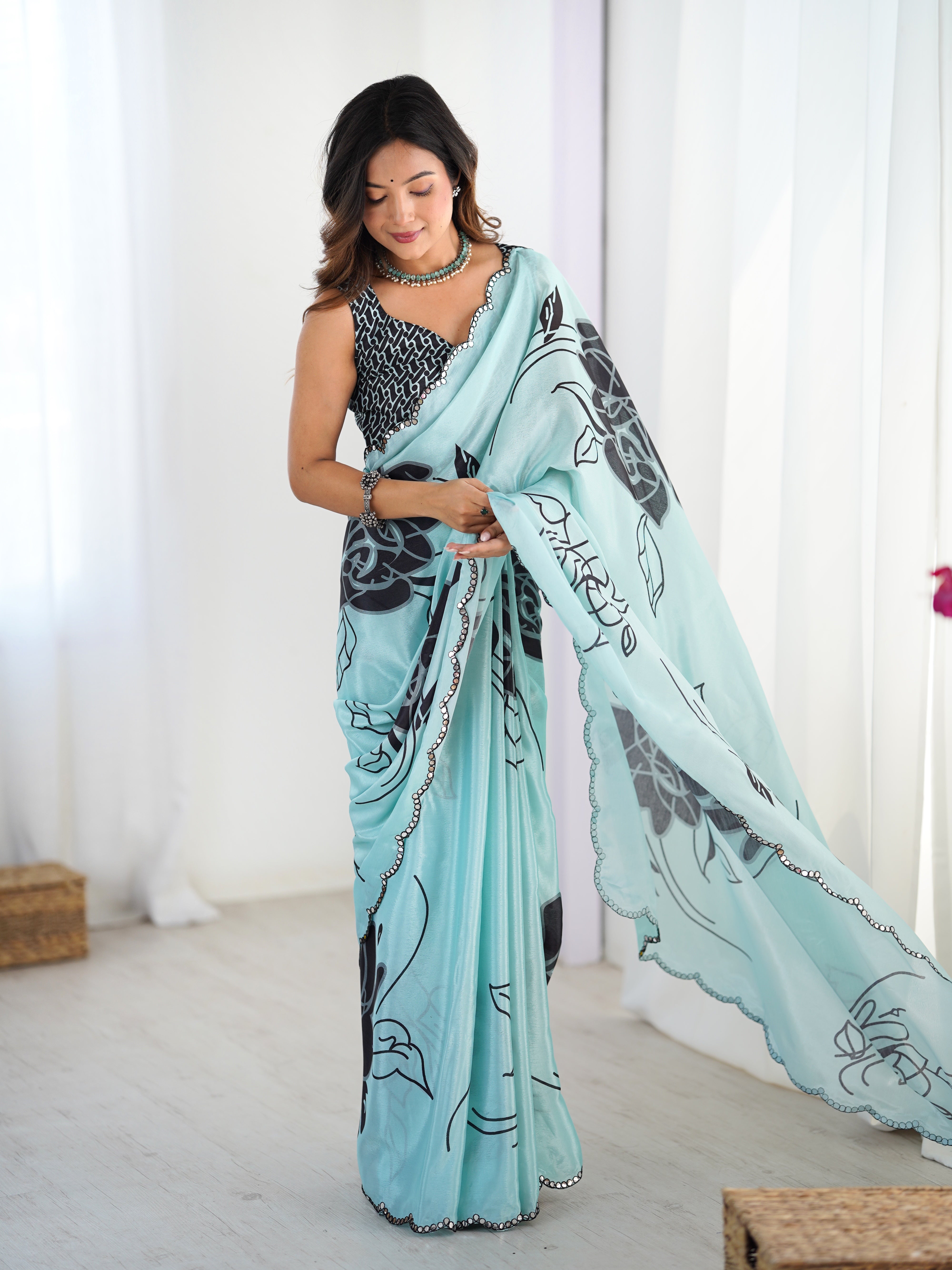 TRENDBUY Exquisite Aqua floral print Chinnon saree with dazzling Kutchi mirror border