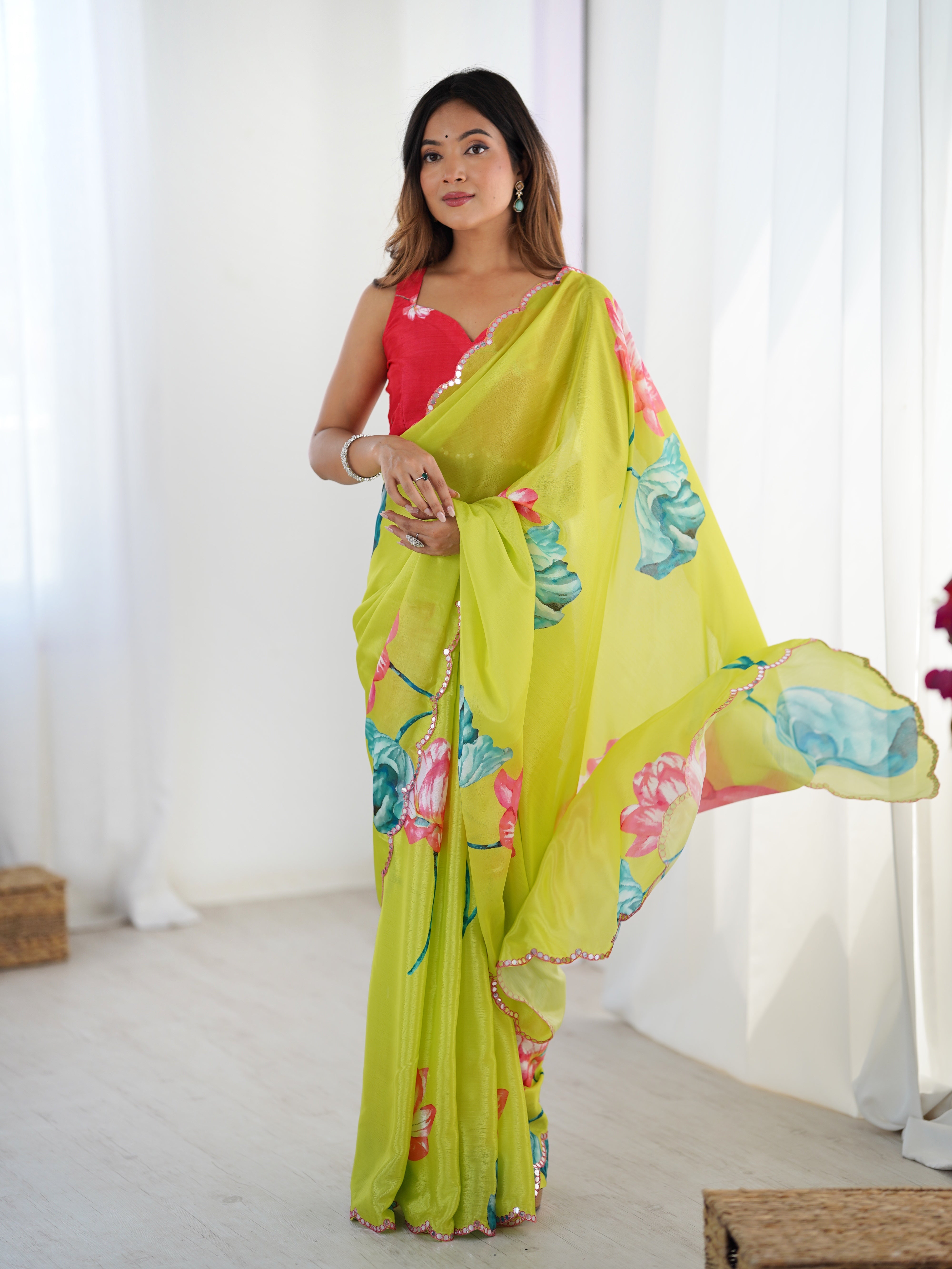 Vibrant floral print heavy chinnon saree with detailed Kutchi mirror lace border