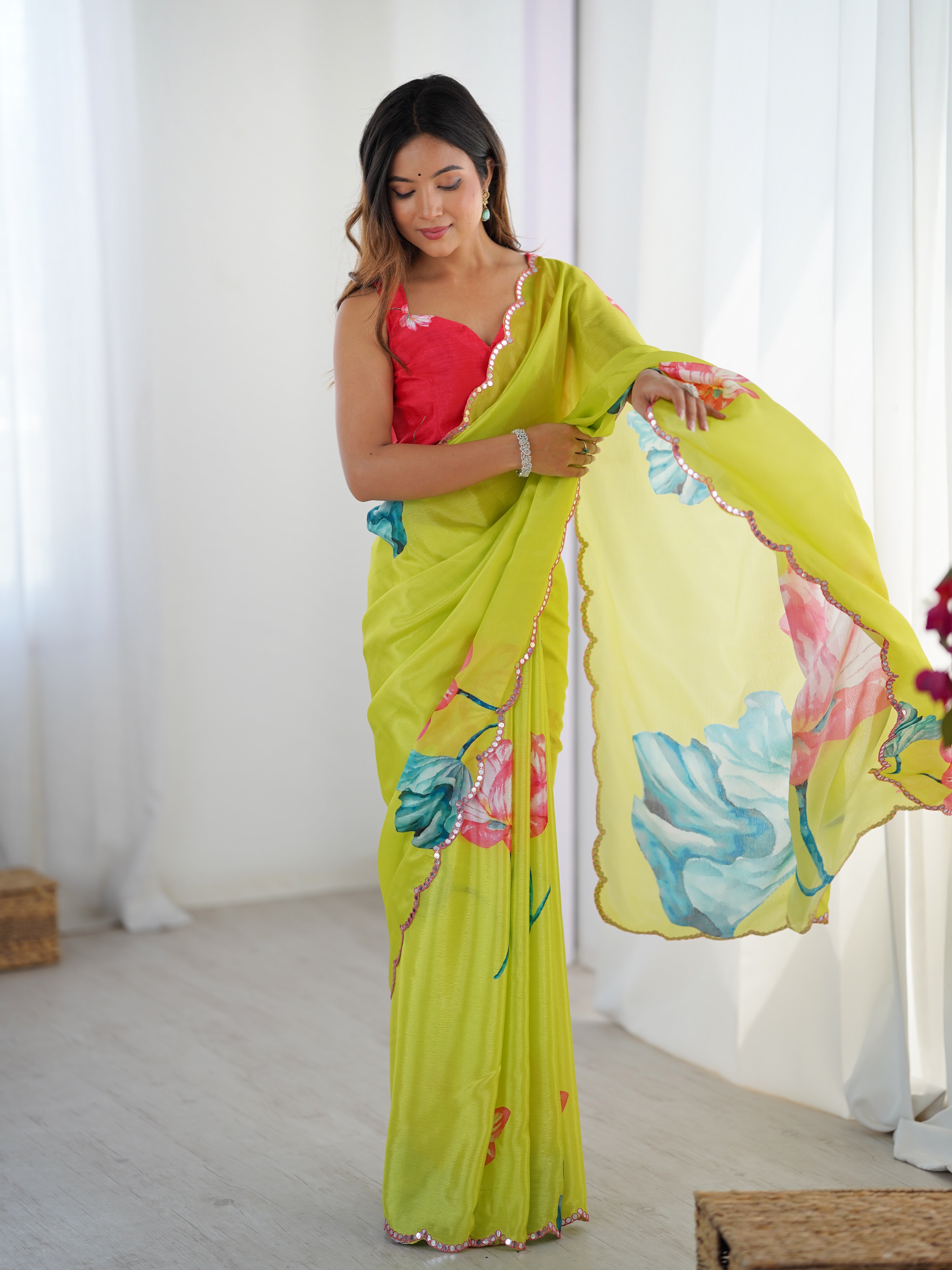Vibrant floral print heavy chinnon saree with Kutchi mirror lace border