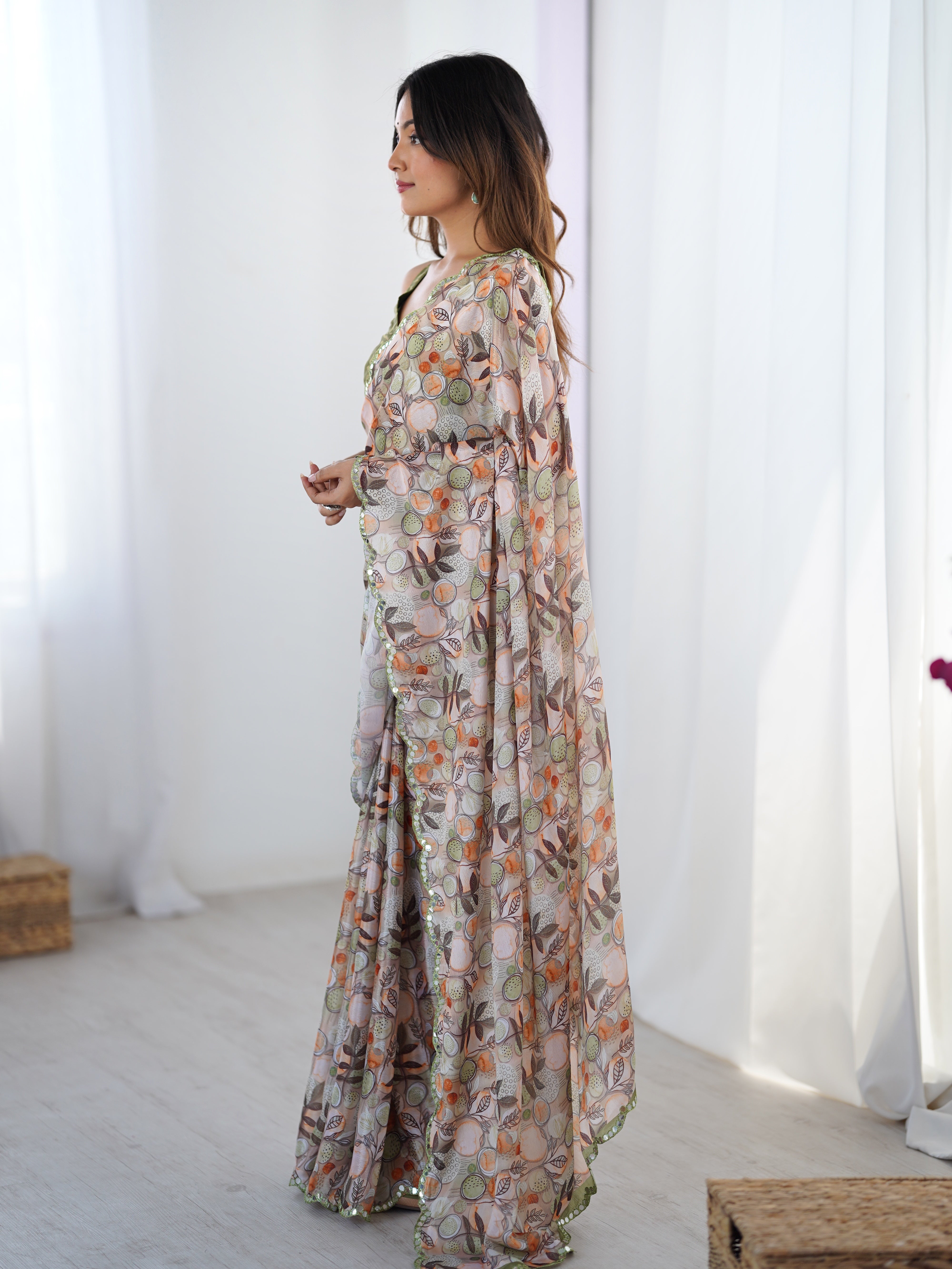 Side profile of a woman in the TRENDBUY printed saree, displaying the full length and elegant border design.