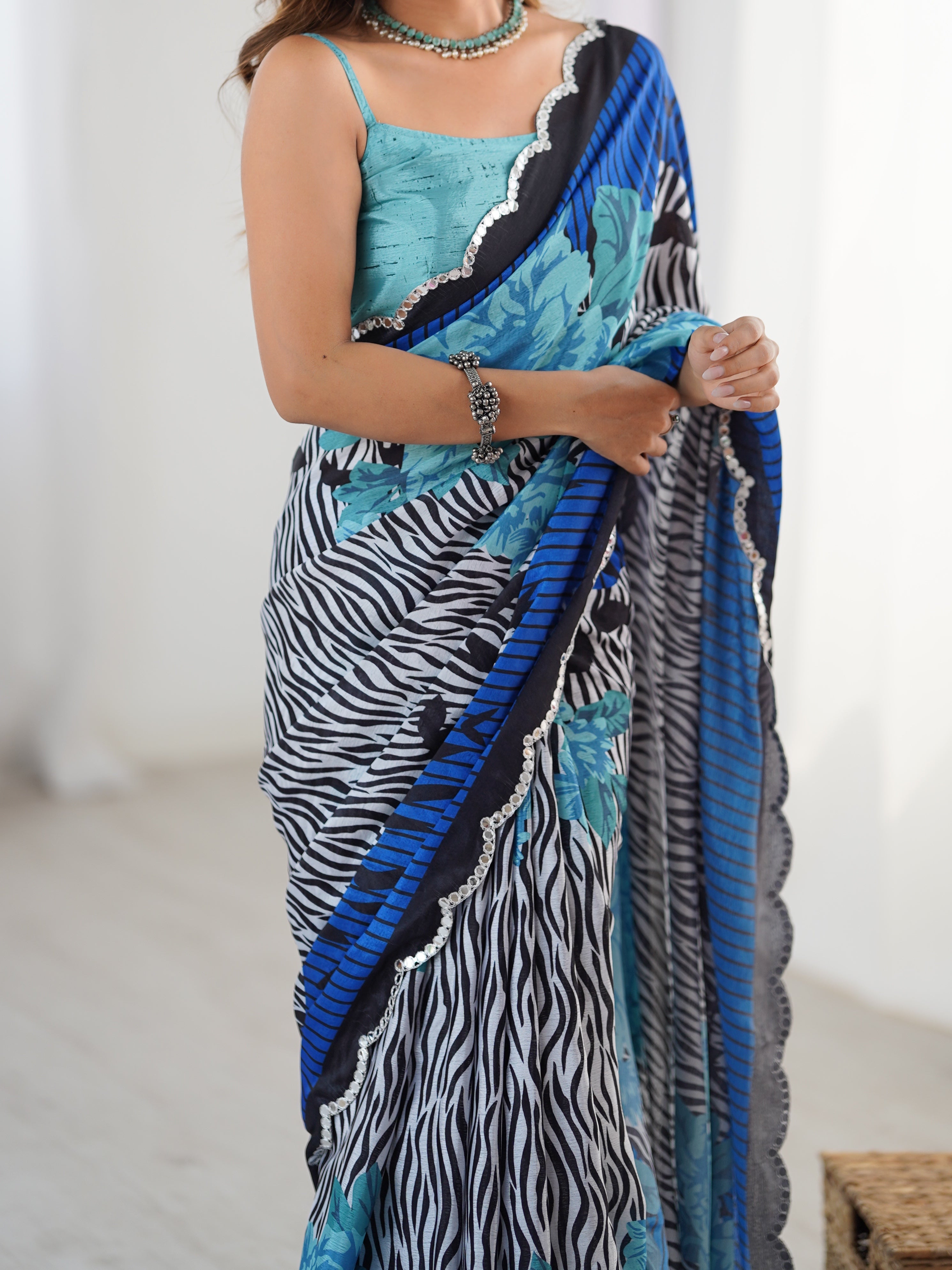 Heavy Chinnon Saree with vibrant print & Kutchi mirror lace border