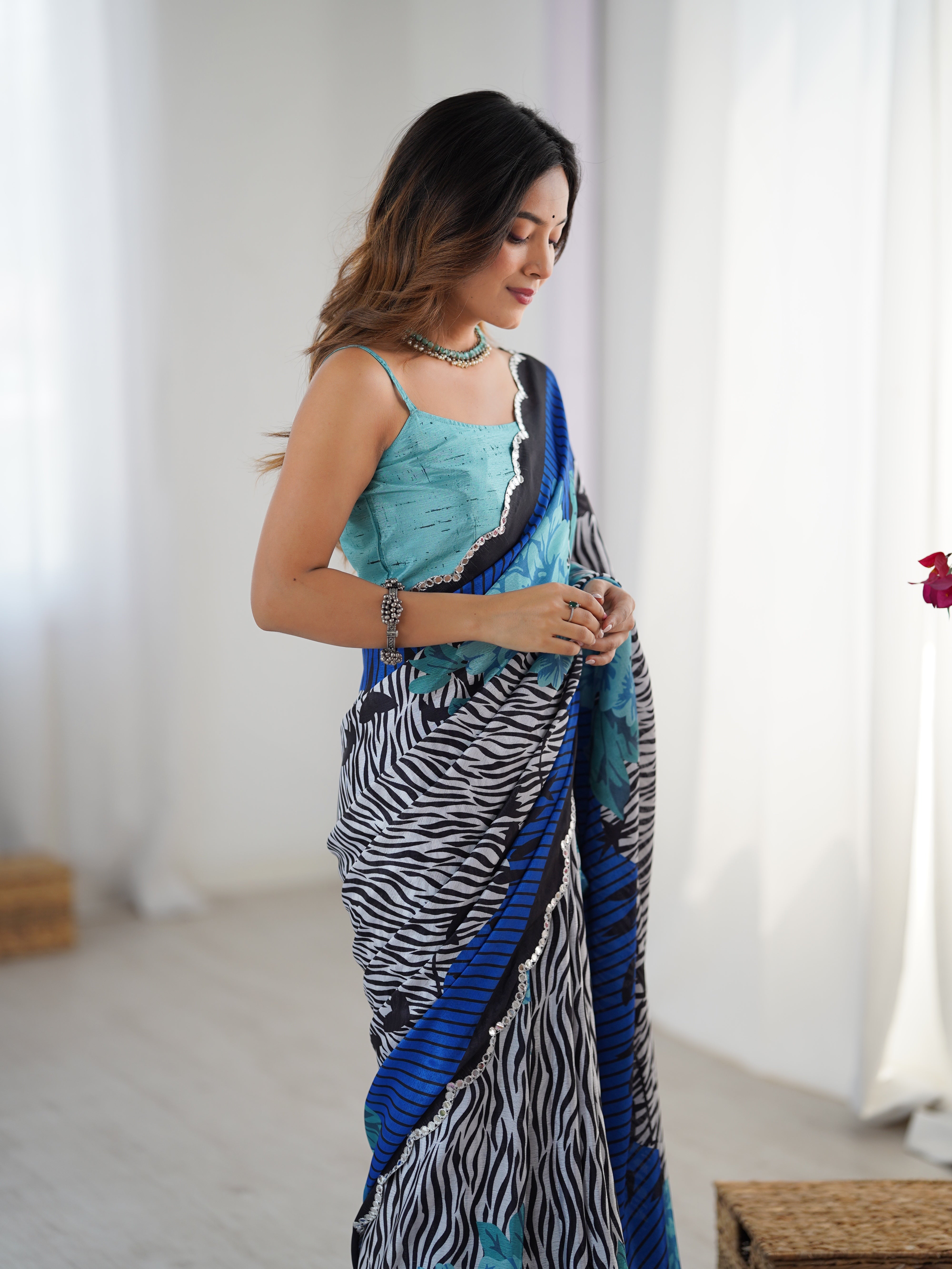 Heavy Chinnon Saree with vibrant print & Kutchi work mirror lace border