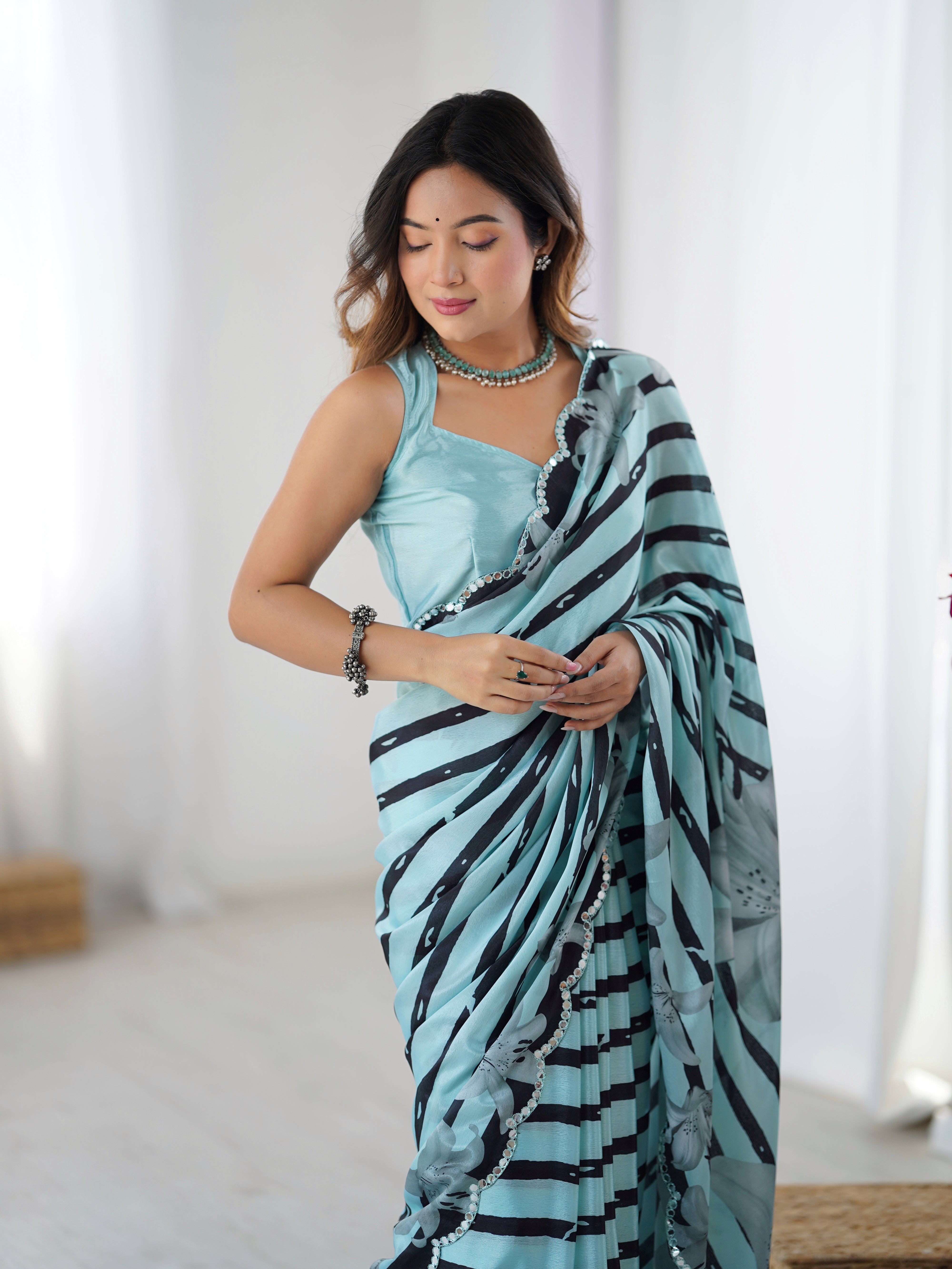 Elegant Aqua Blue Heavy Chinnon Saree with Striped Print and Kutchi Mirror Lace
