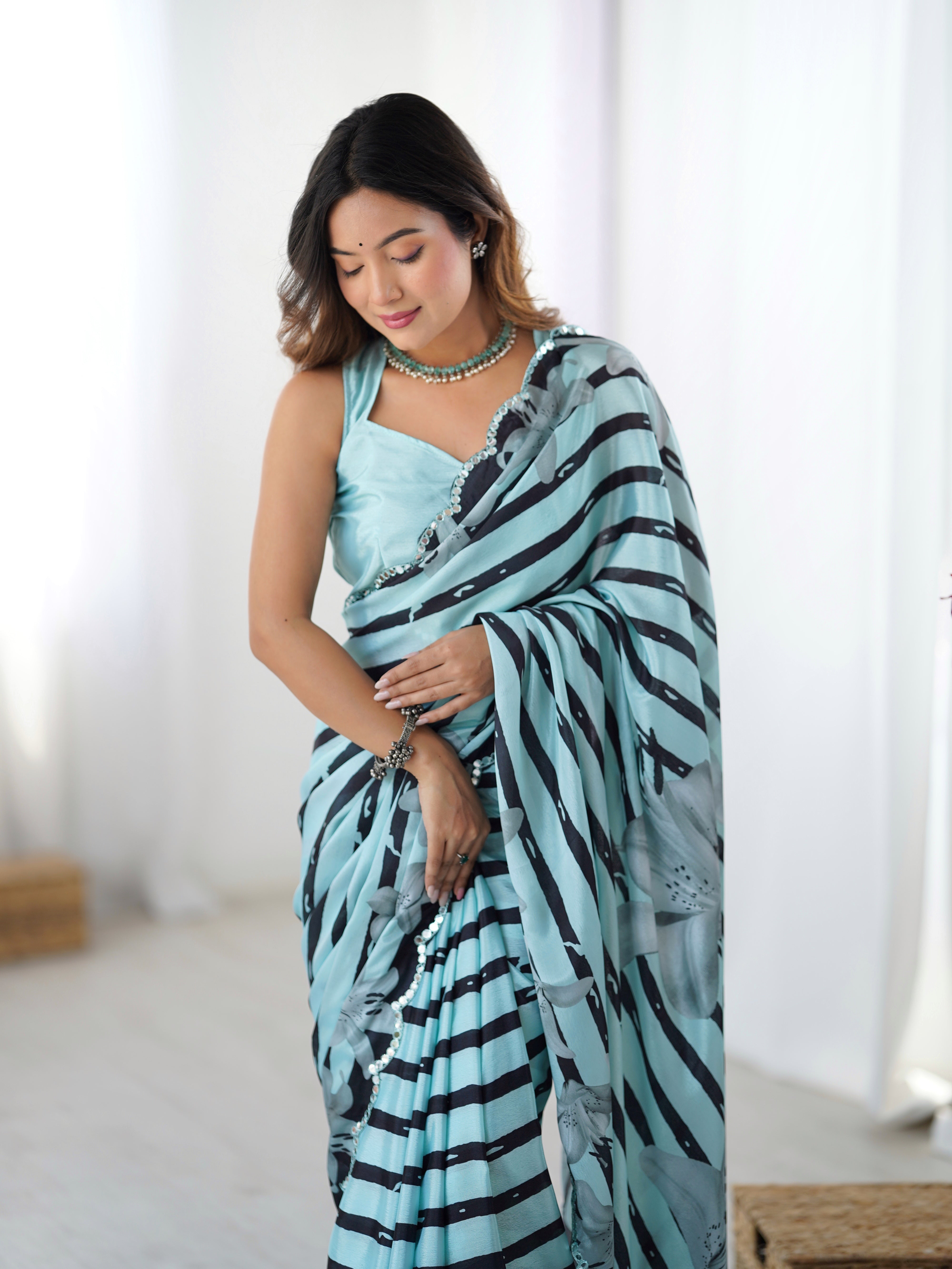 Elegant aqua blue chinnon saree with striped print & Kutchi mirror lace