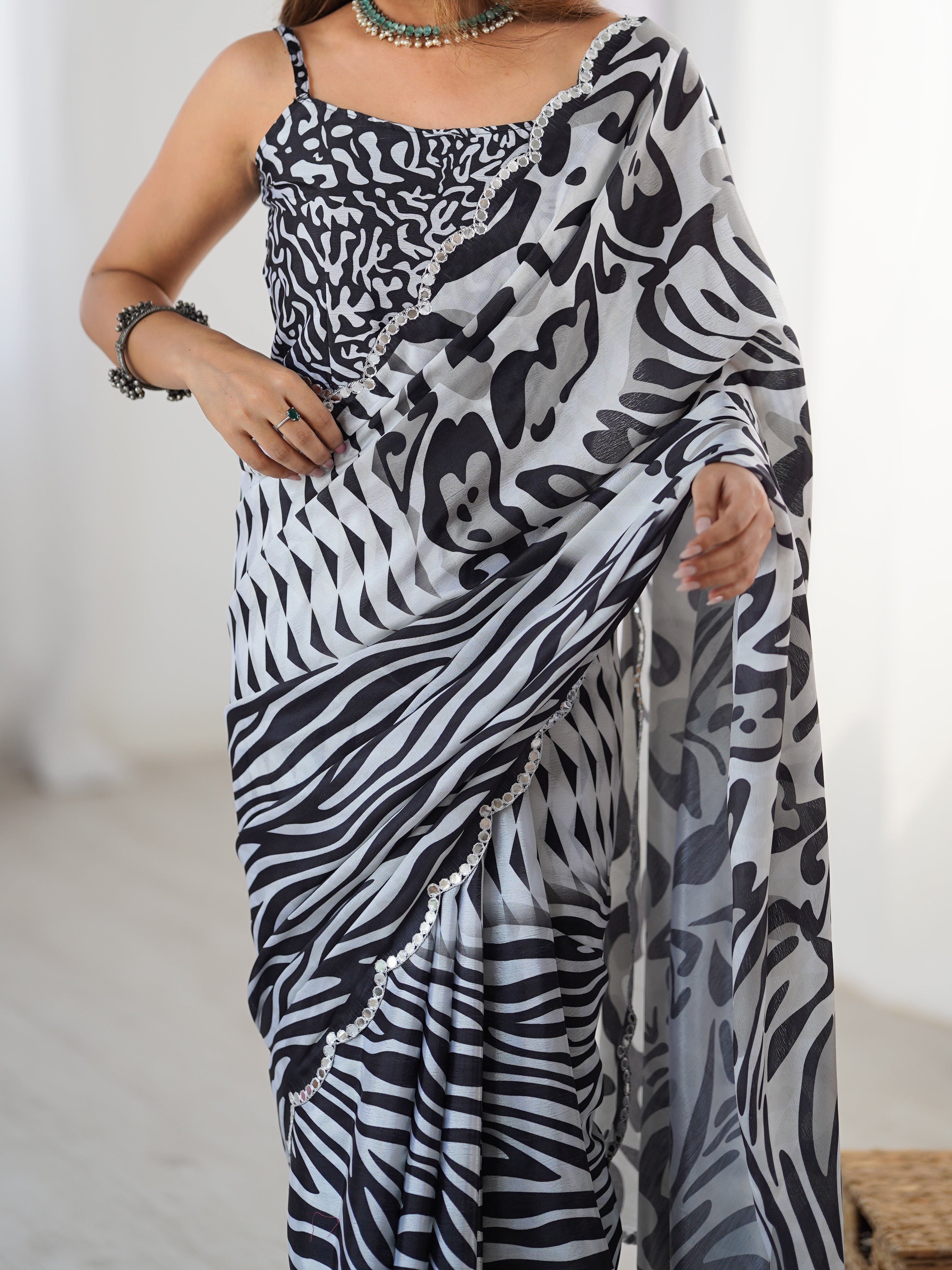 Chic black & white chinnon saree with prominent Kutchi mirror lace border