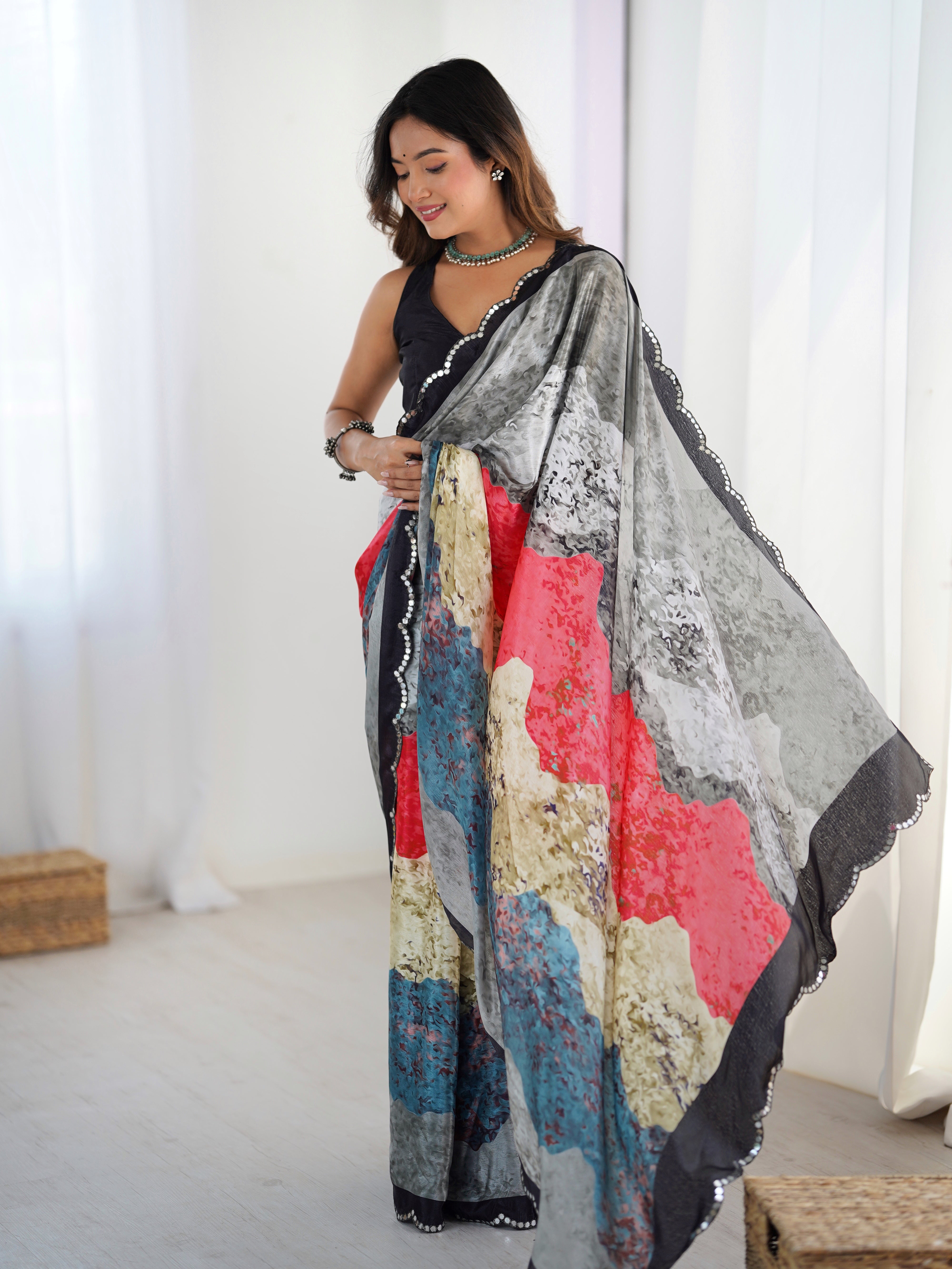 Vibrant print heavy Chinnon Saree with Kutchi mirror work border