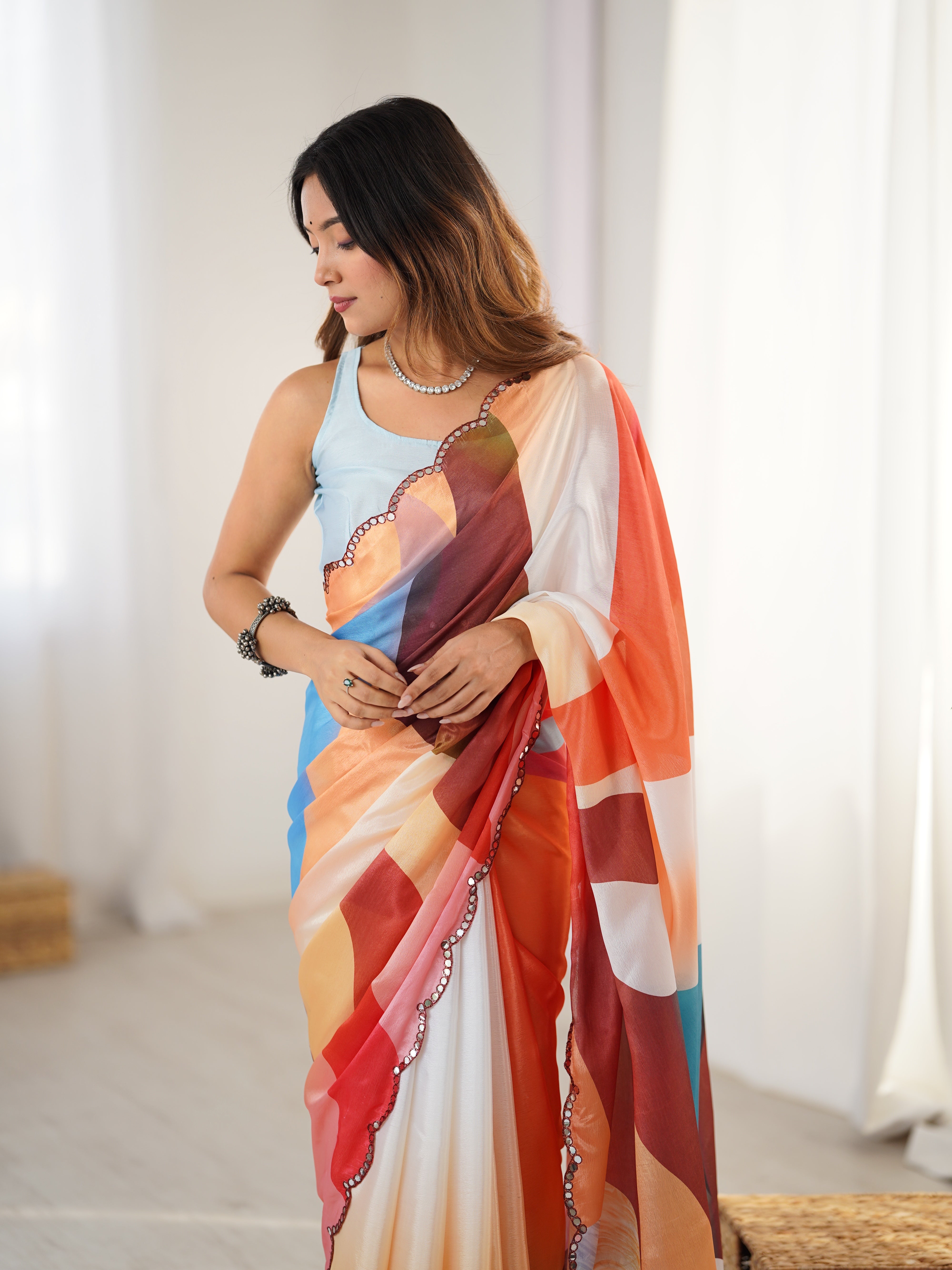 Heavy Chinnon Saree with vibrant print and Kutchi mirror work border