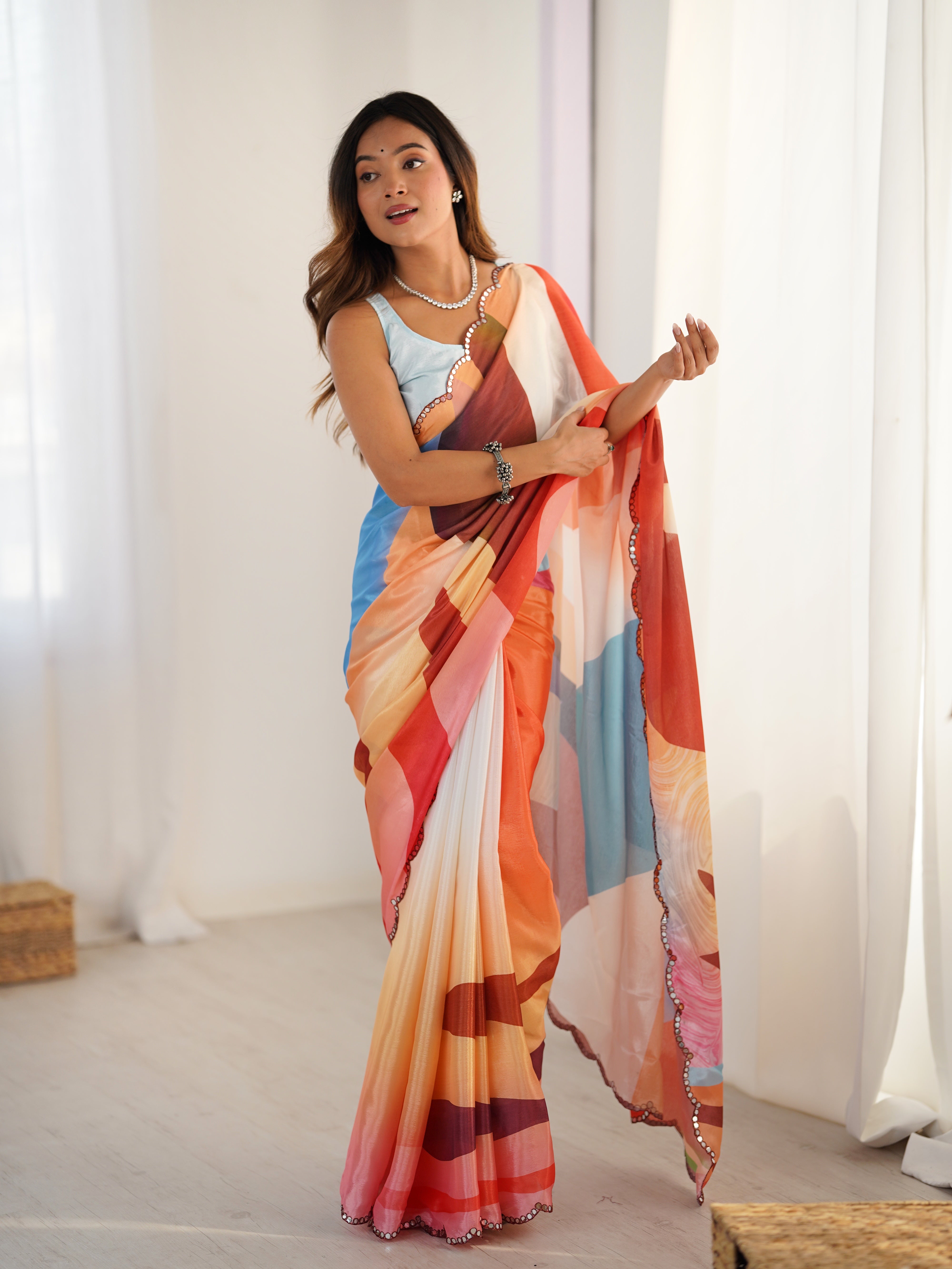 Heavy Chinnon Saree with vibrant print and Kutchi mirror work border