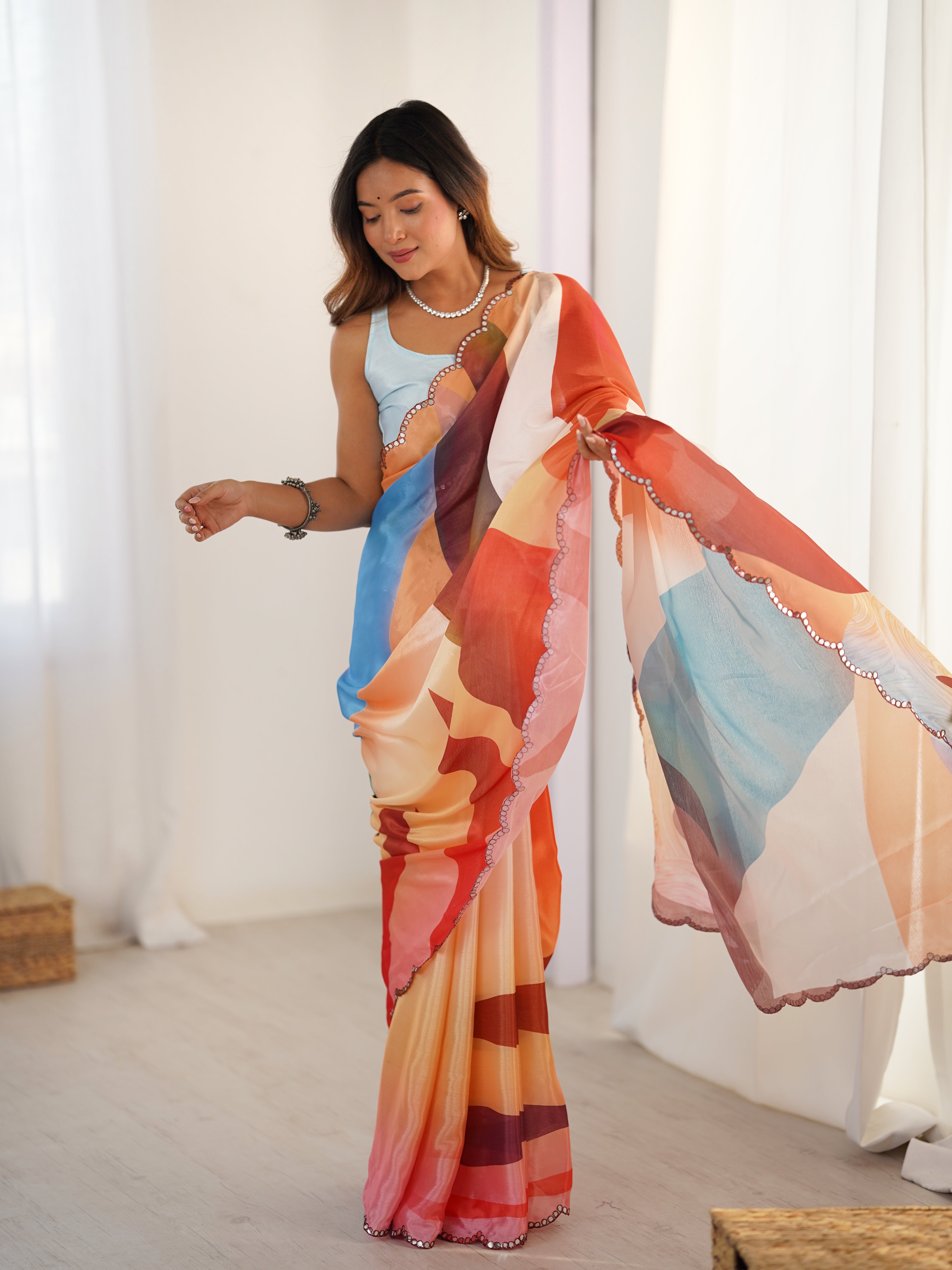 TRENDBUY Heavy Chinnon Saree: vibrant print & Kutchi mirror work border detail