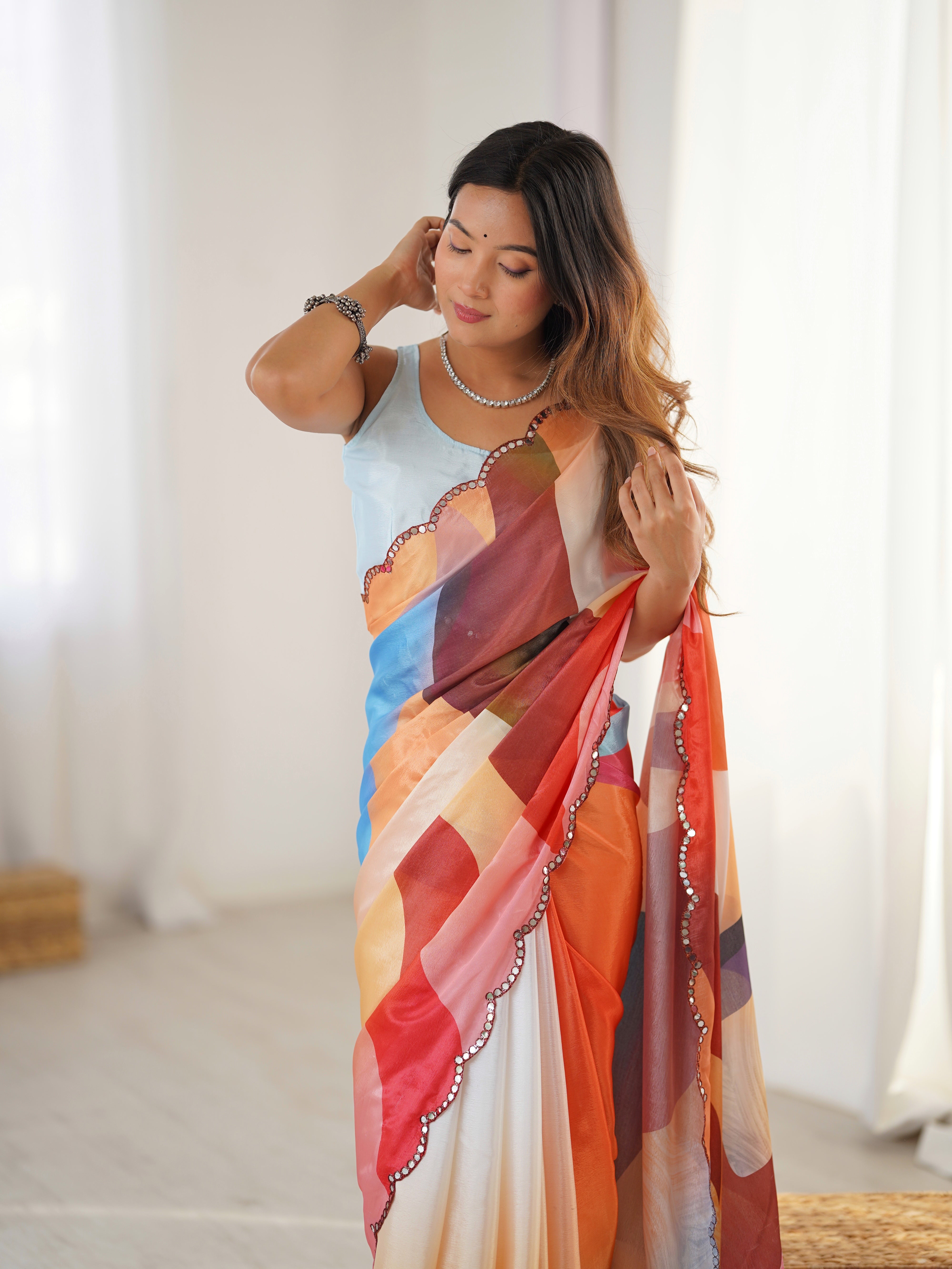 TRENDBUY Heavy Chinnon Saree with vibrant print & Kutchi mirror work border
