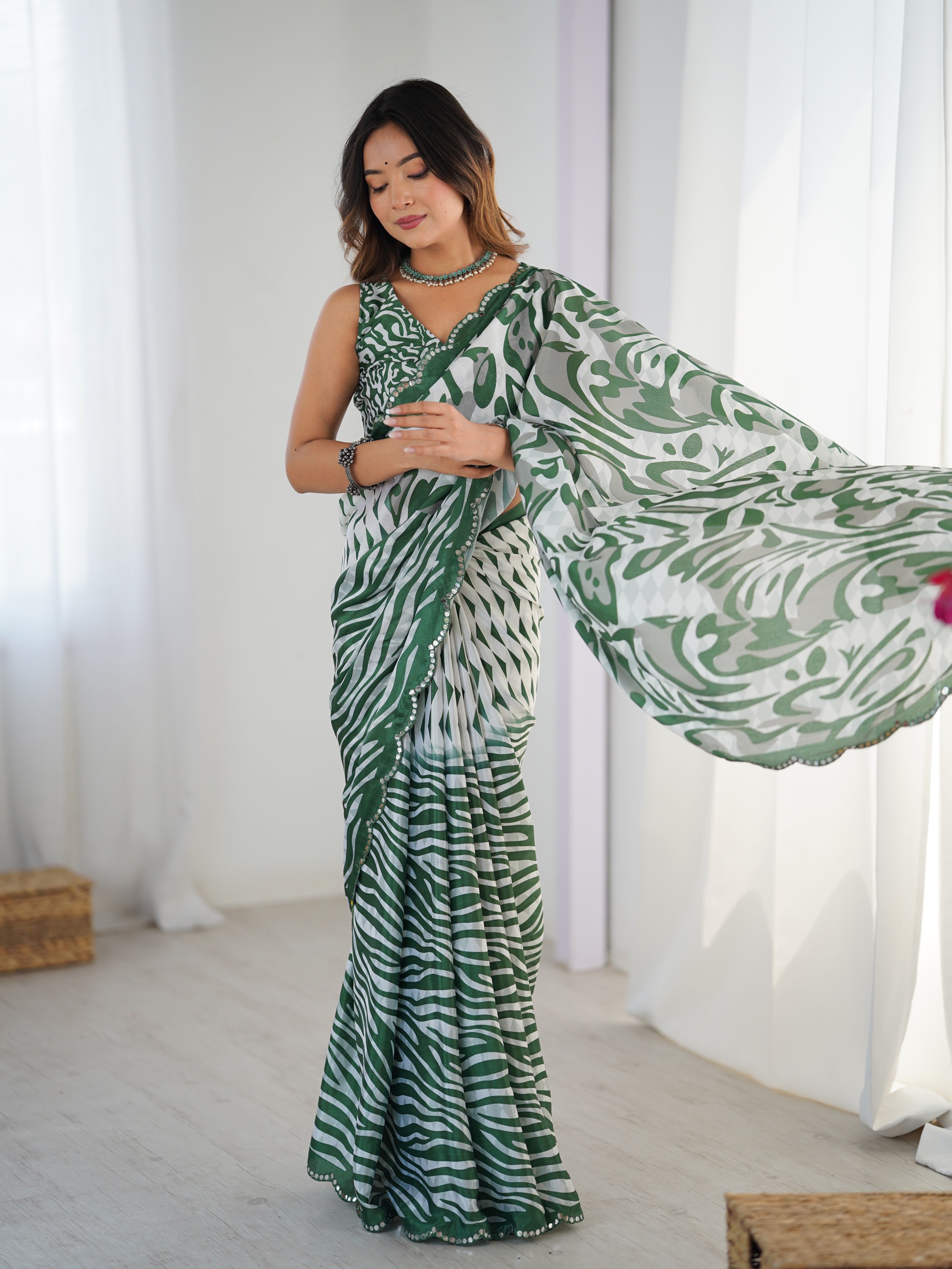 TRENDBUY DVS-85 Heavy Chinnon Saree displaying Kutchi mirror lace border and detailed print work.