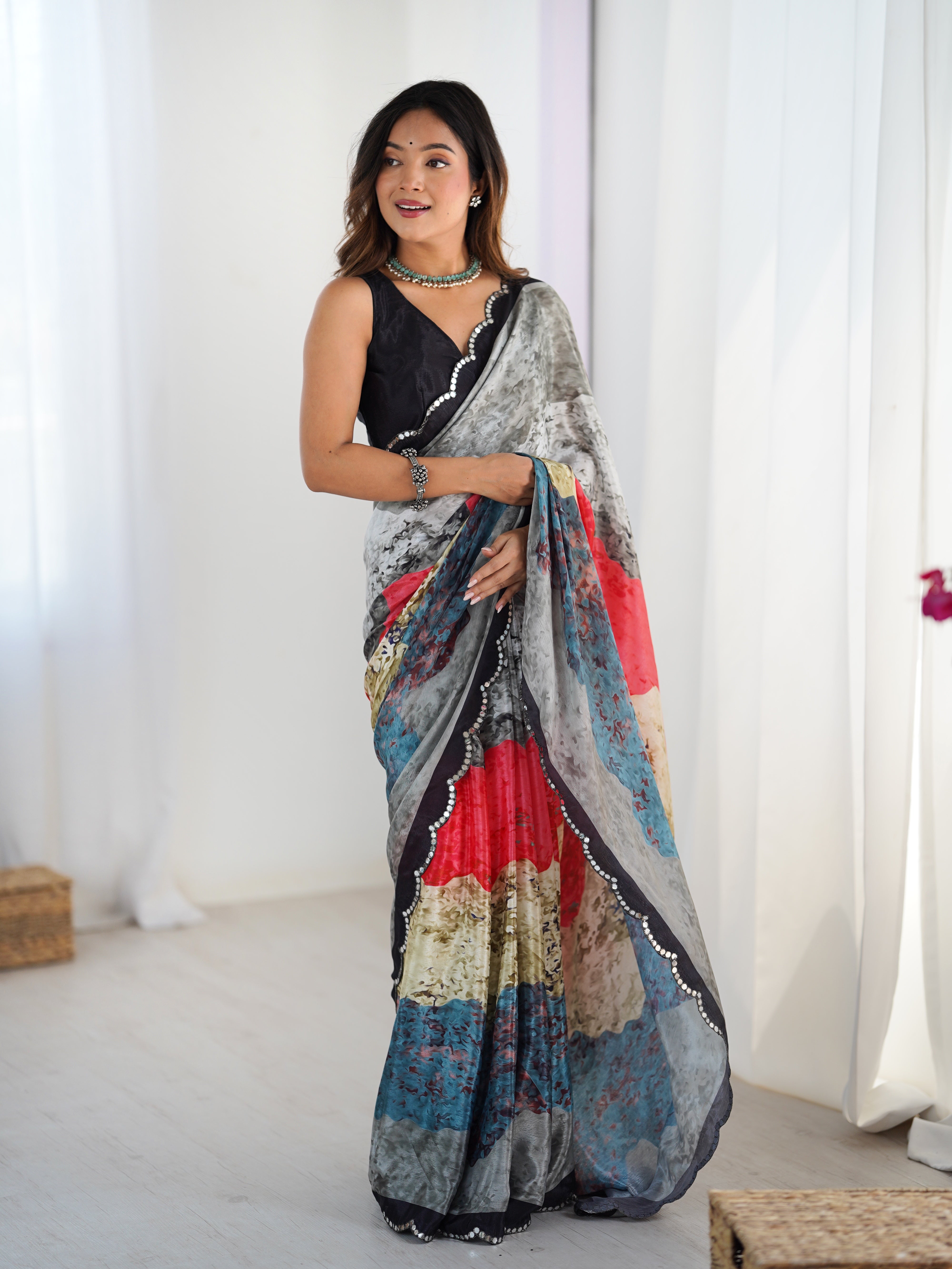 TRENDBUY Exclusive Heavy Chinnon Saree with vibrant print and beautiful Kutchi mirror lace border.