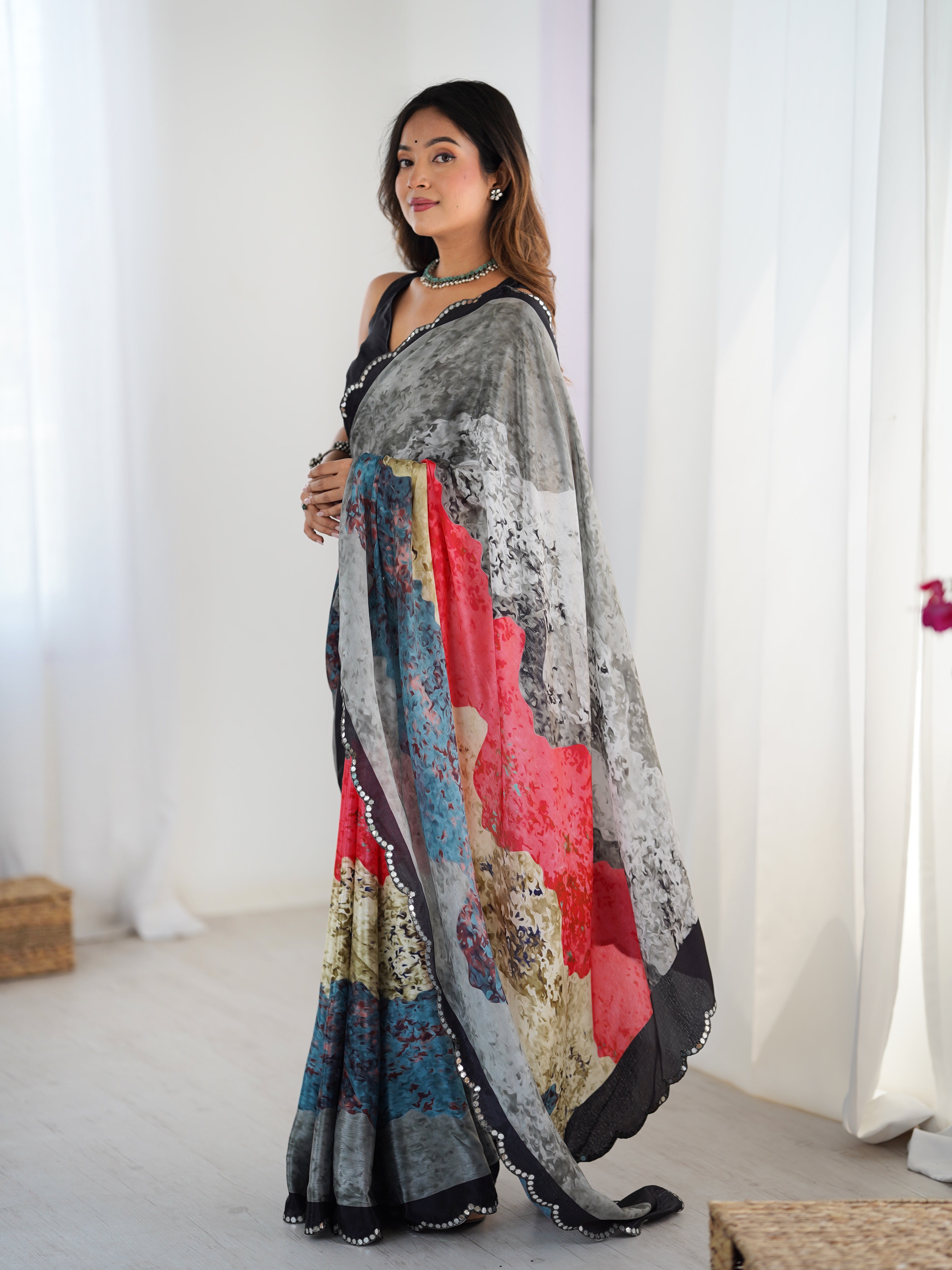 Heavy Chinnon Saree with vibrant print and Kutchi mirror lace border