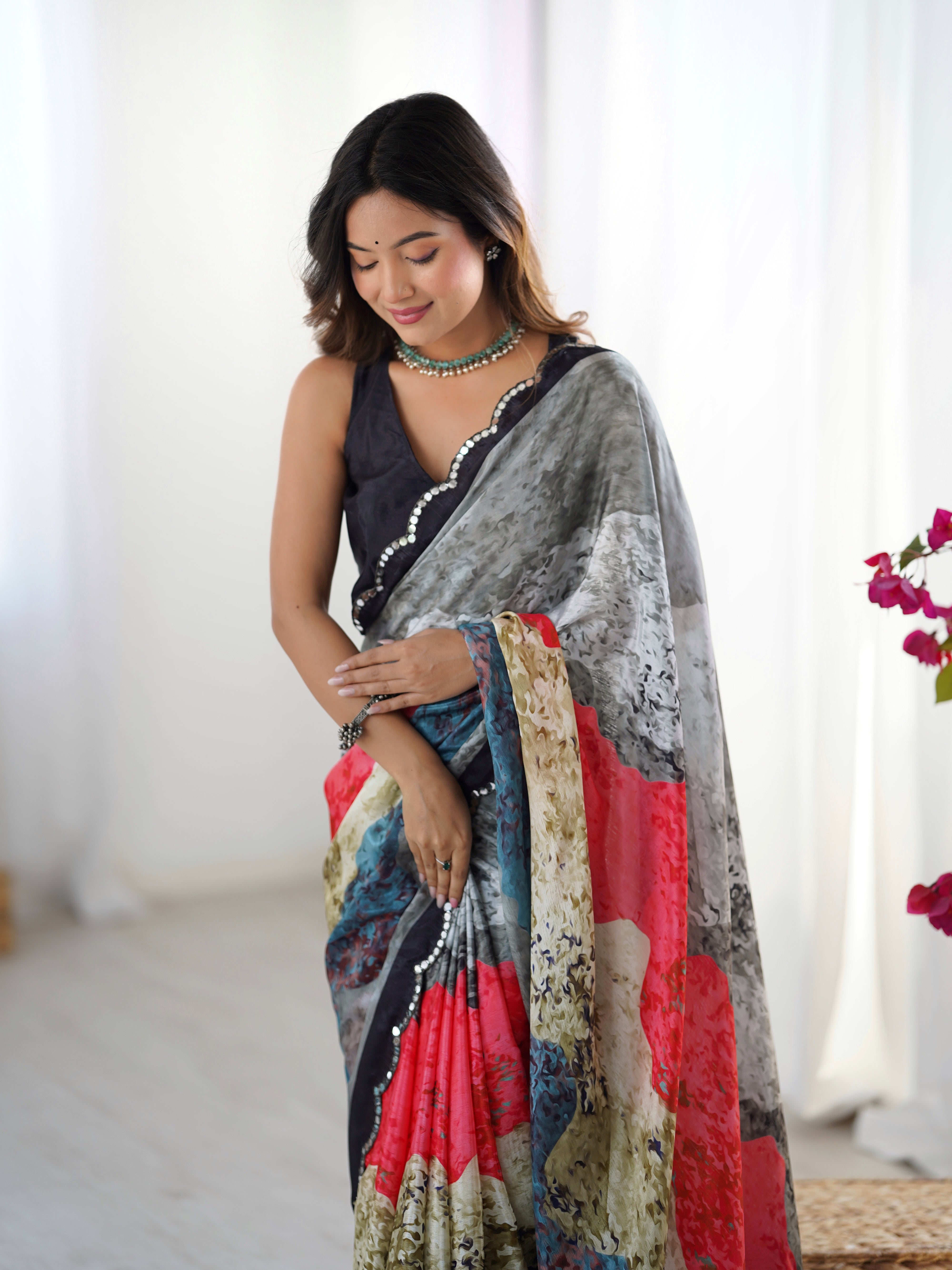 TRENDBUY Heavy Chinnon Saree showcasing vibrant print and intricate Kutchi mirror lace border.