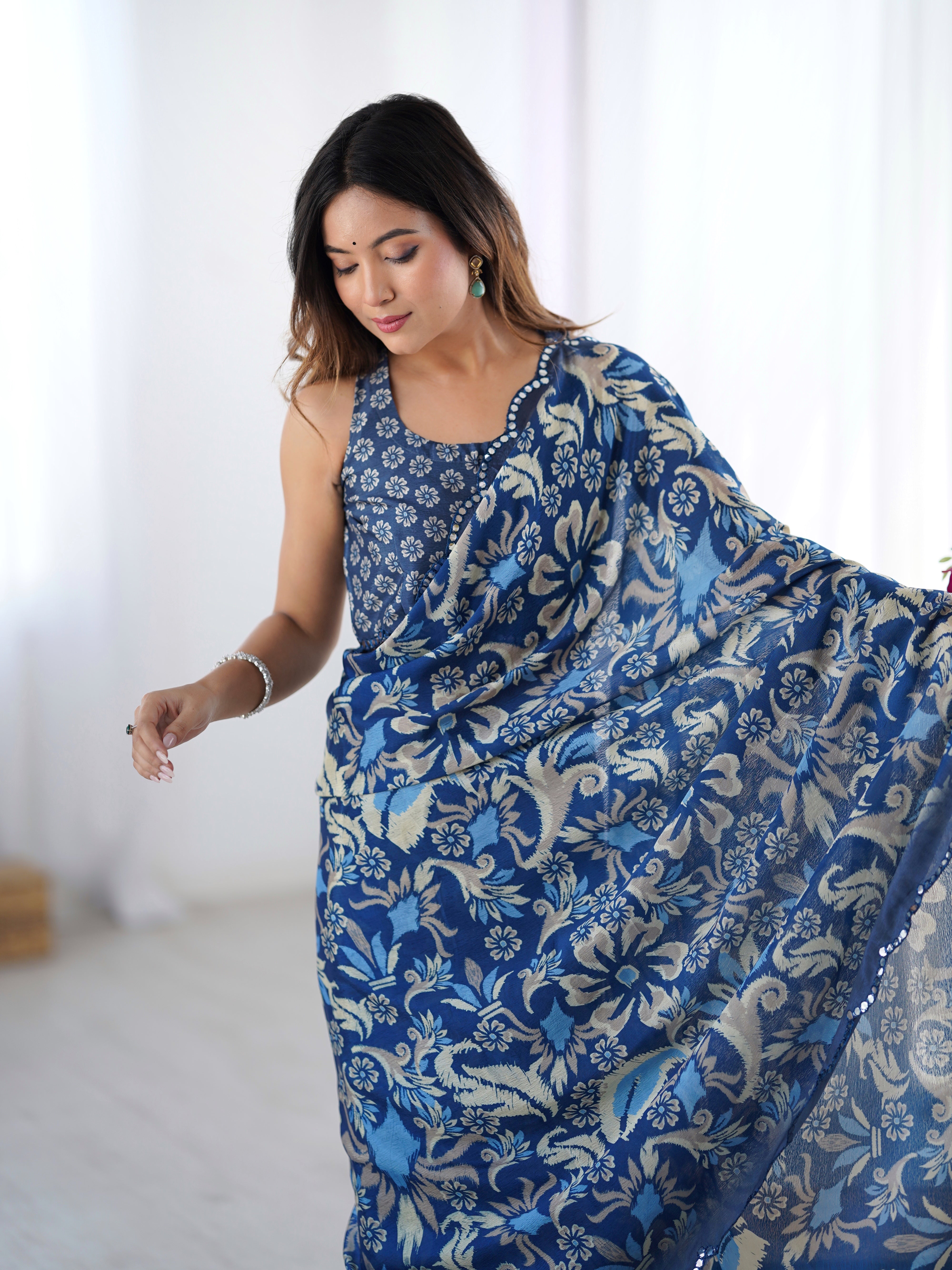 TRENDBUY DVS-92 heavy Chinnon saree with intricate Kutchi mirror work lace border.