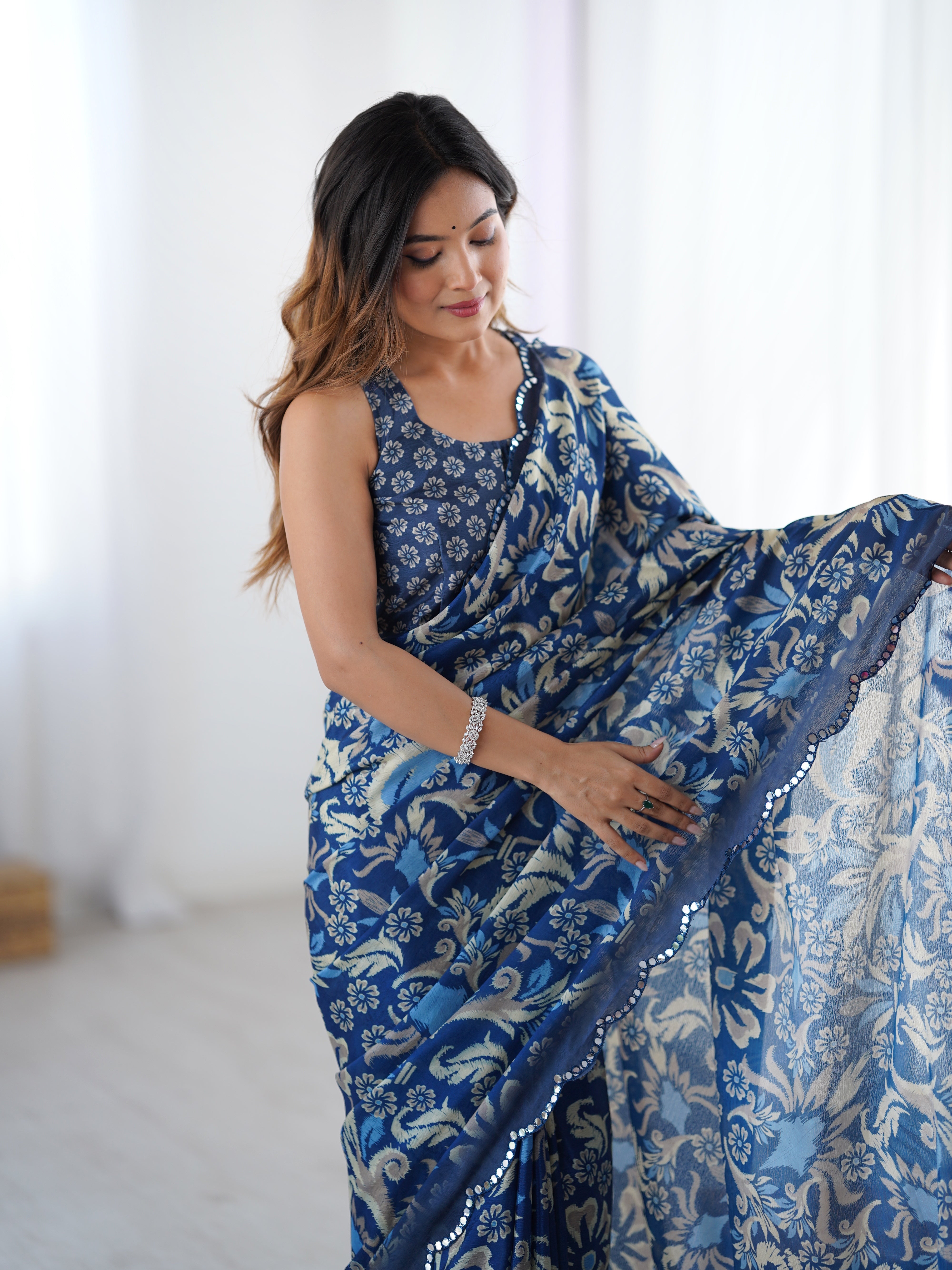 TRENDBUY DVS-92 Heavy Chinnon Saree with intricate Kutchi mirror work lace and unstitched blouse.