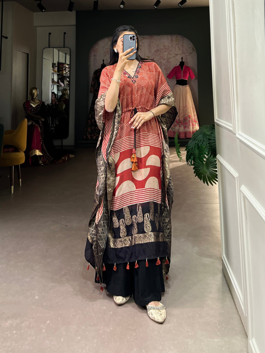 Woman modeling a daily wear Viscose Kaftan with an elegant Zari Border design.