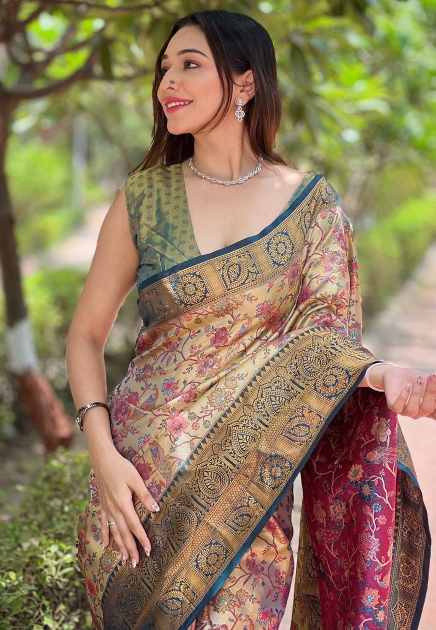 Close-up of intricate gold metallic zari embroidery on the border