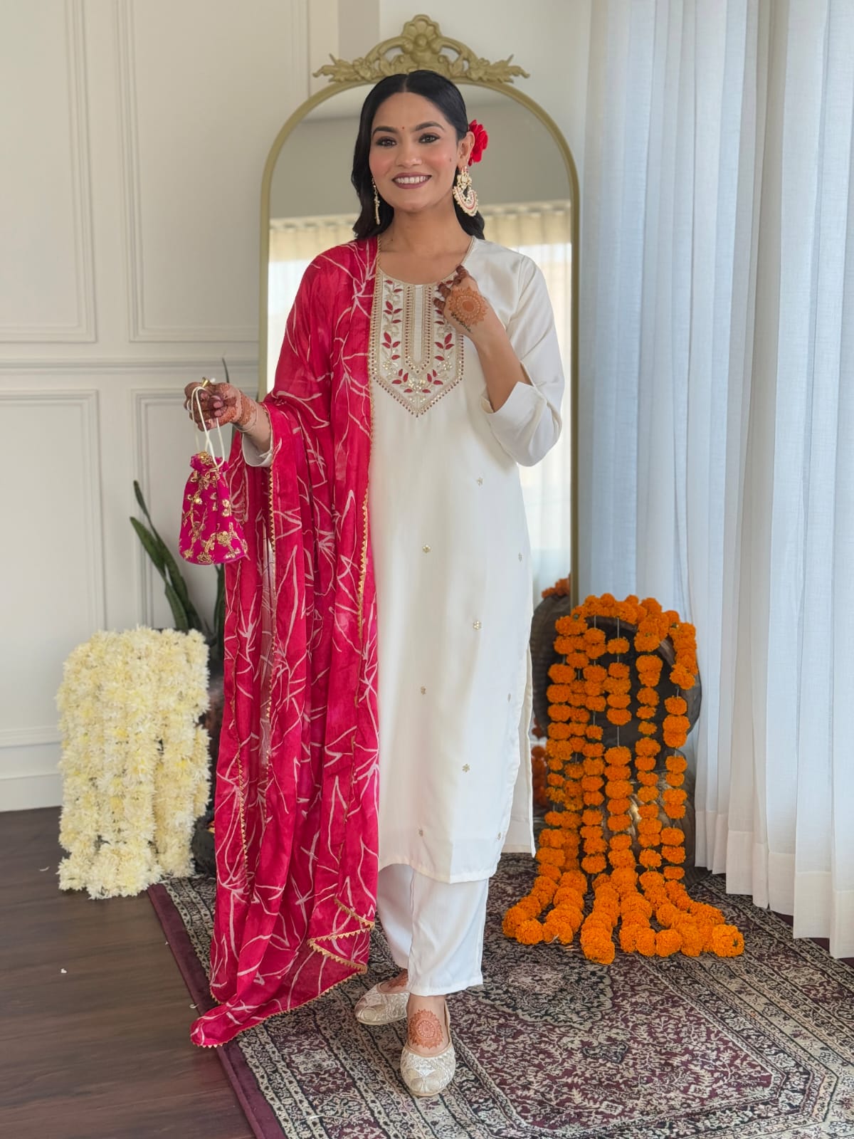 TRENDBUY model standing confidently in the complete white embroidered kurti, pant, and pink foil printed dupatta set, ready for an event.