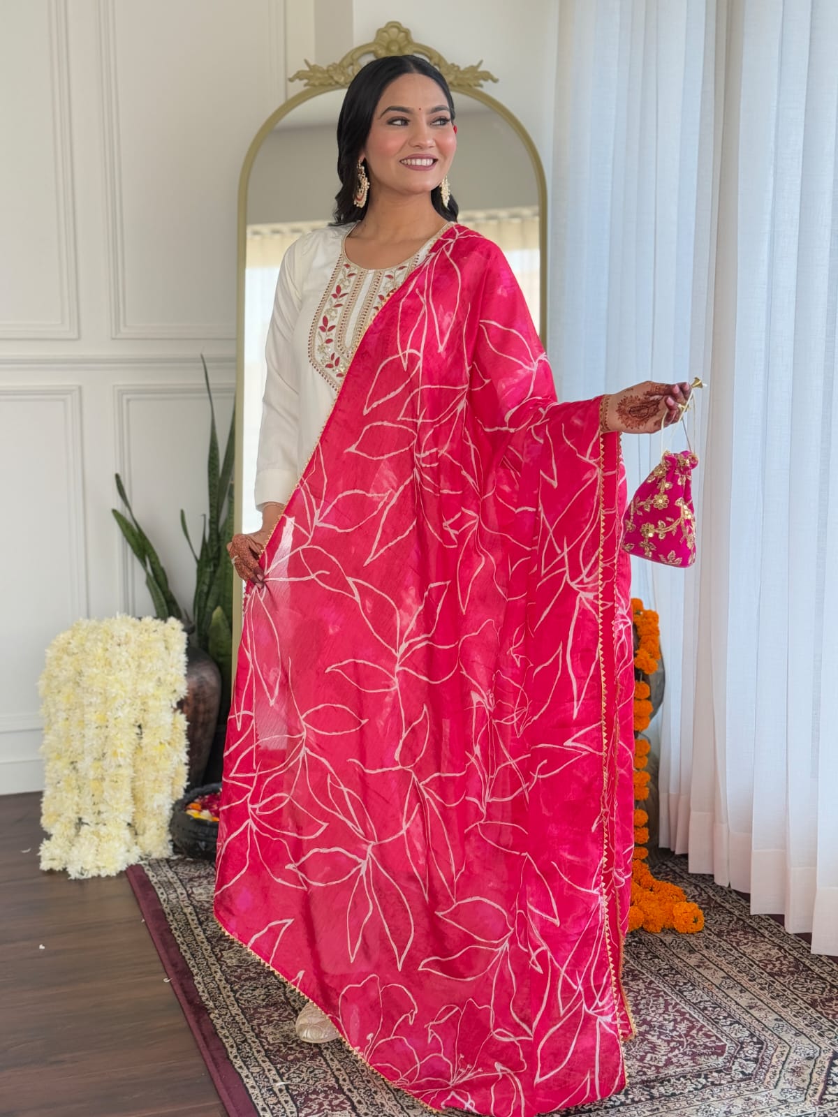 Close-up of the vibrant pink chinon foil printed dupatta with white leaf patterns, draped elegantly by a TRENDBUY model, highlighting the fabric and print.