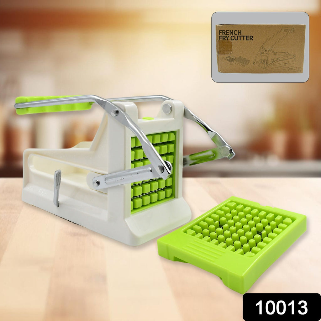 Stainless steel professional french fry cutter actively slicing potatoes and other vegetables into fries.