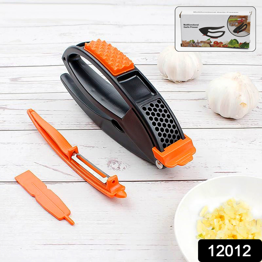 Multifunctional stainless steel garlic press mincing fresh garlic cloves for cooking.