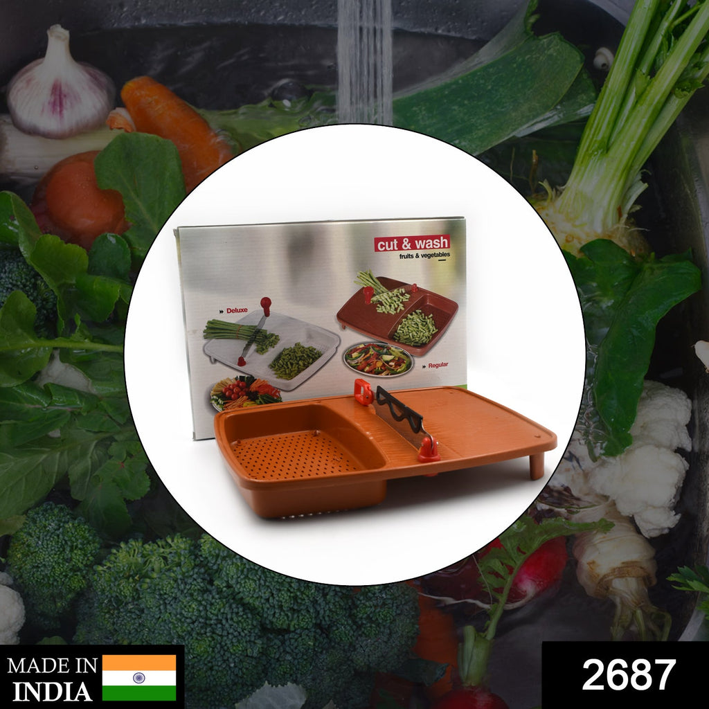 Hands using a Cut N Wash Box And Tray for washing fruits & vegetables above a cutting surface.
