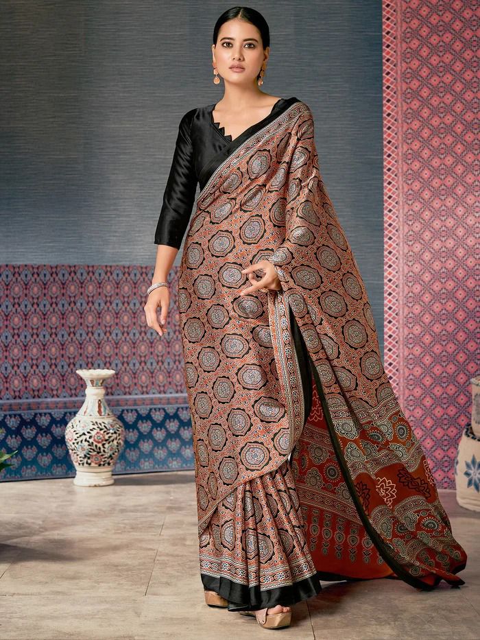 Fancy Ajrakh print saree, an elegant traditional Indian drape with unique block patterns.