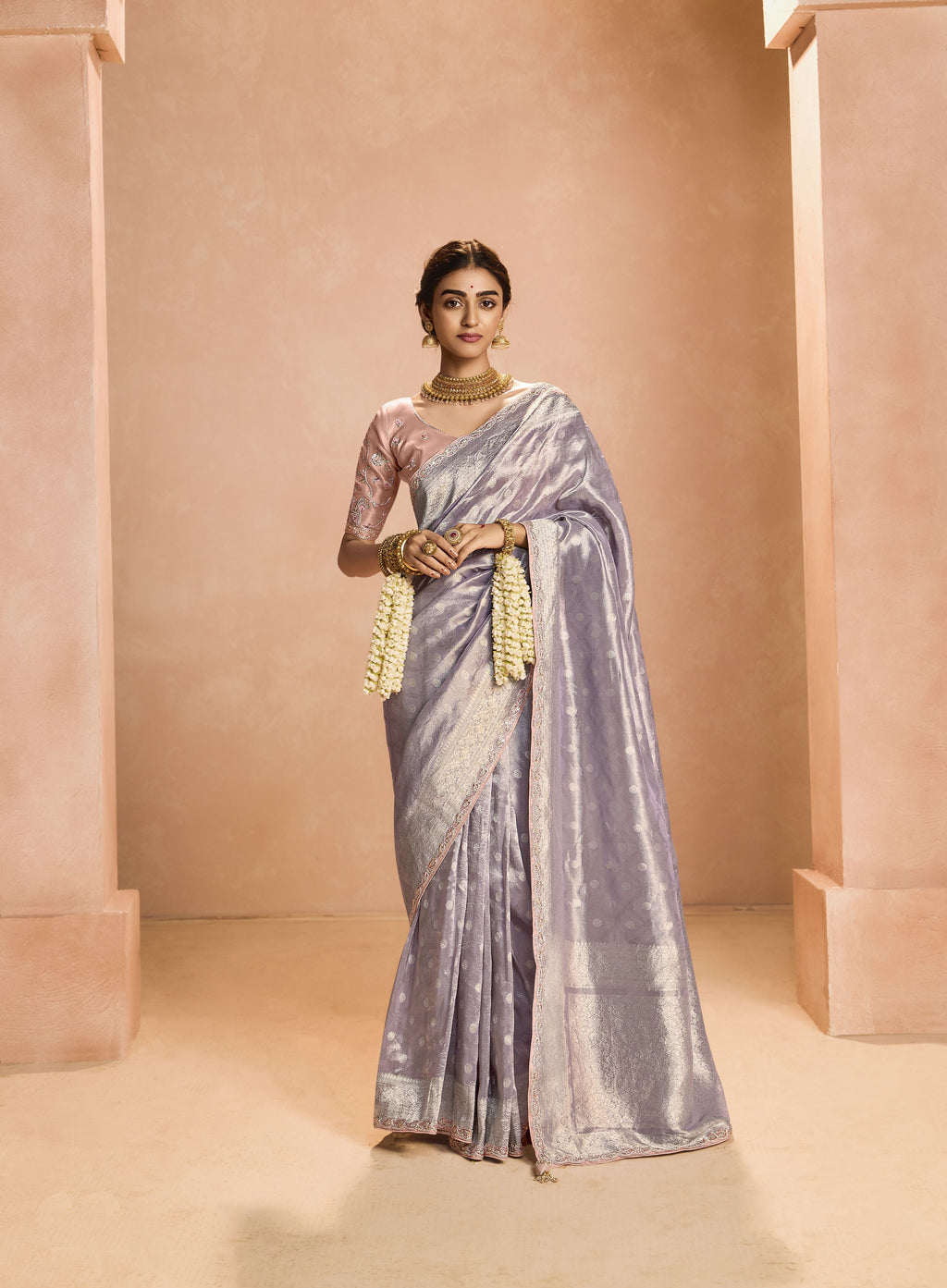 Stunning Festival Wear Heavy Embroidery Silk Saree draped elegantly, showcasing intricate gold work.