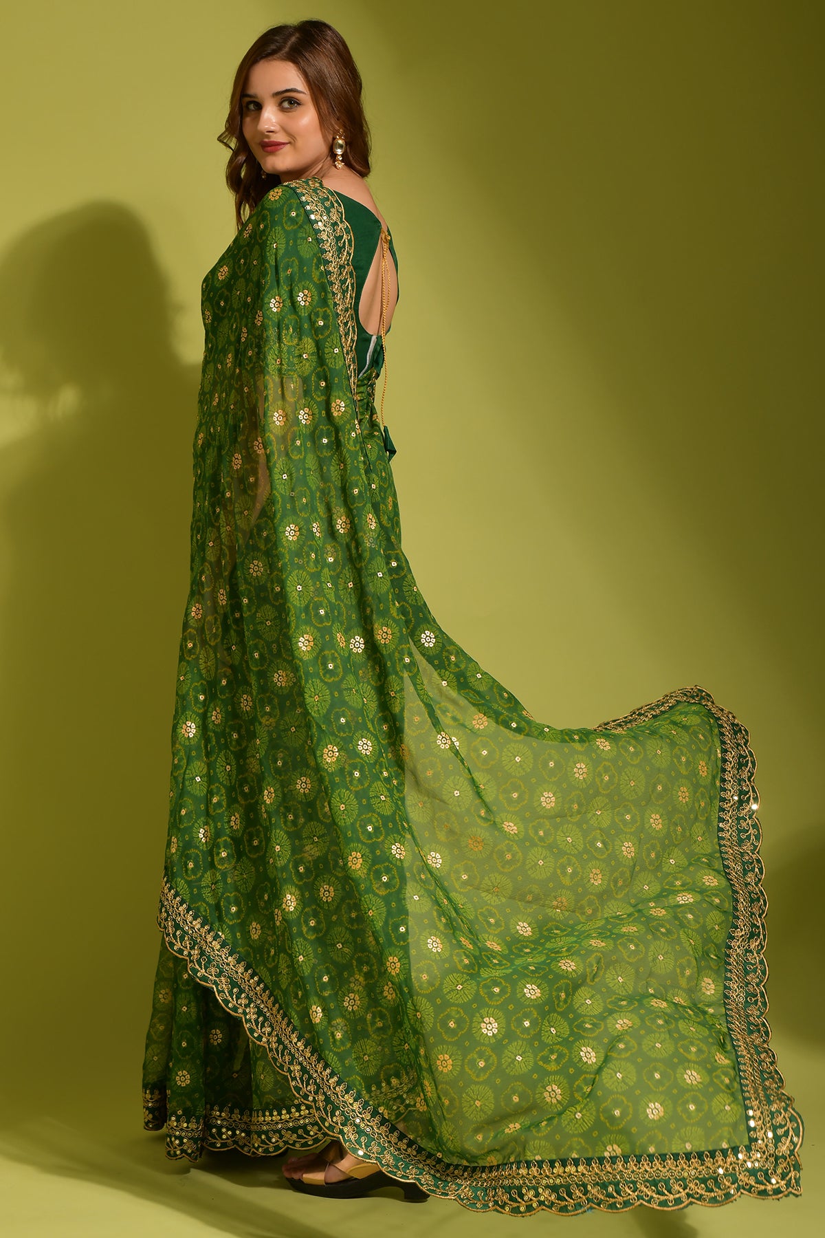 Exquisite green Georgette Chiffon Saree with flower print, foil, and sequin work details.