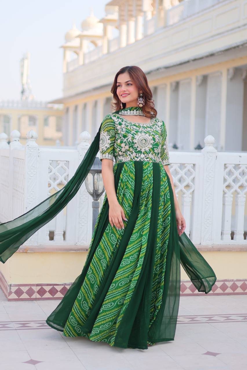 Model showcasing a vibrant green Bandhej festival gown with a matching dupatta.