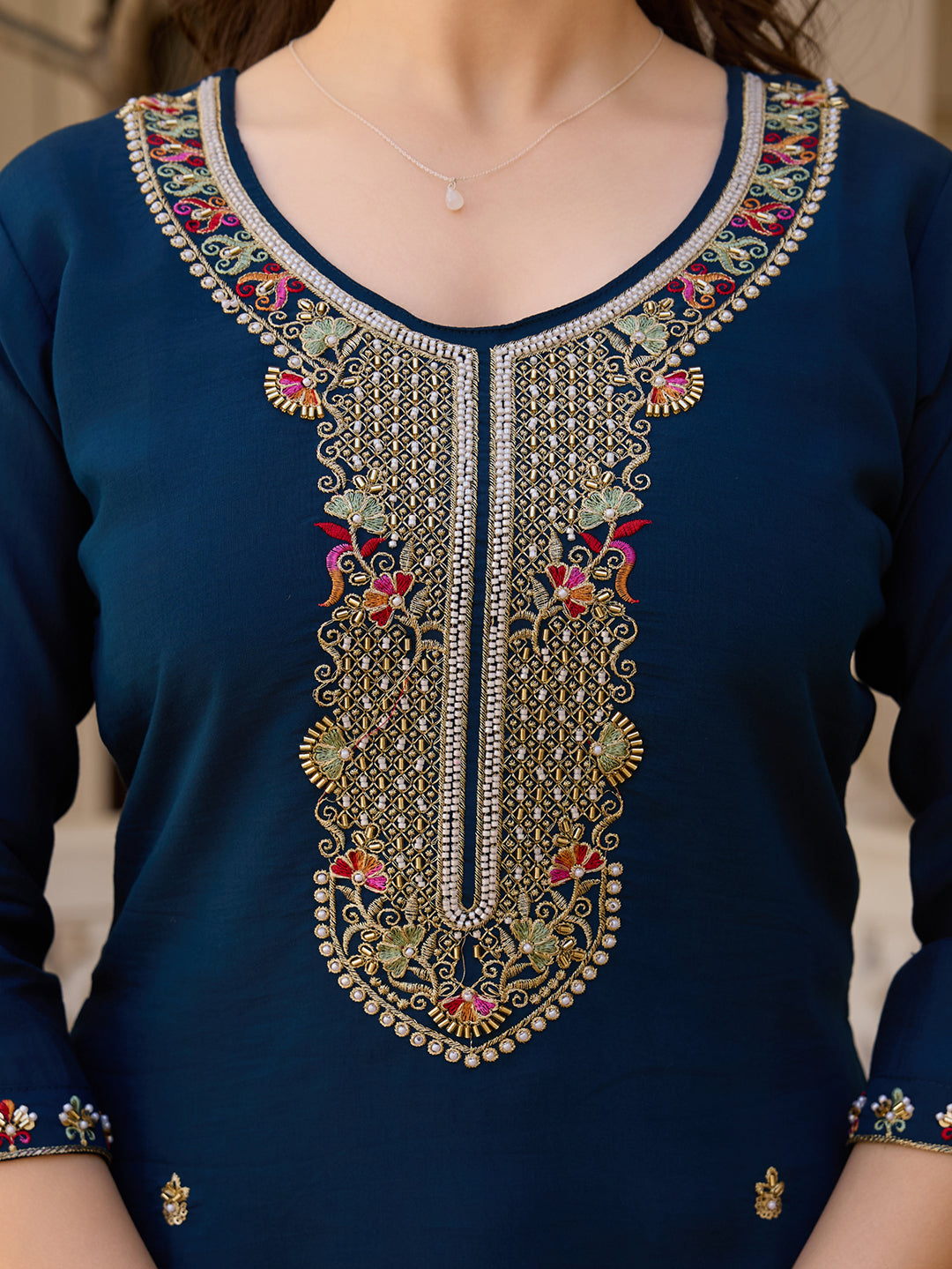 Detailed close-up of the exquisite gold and colorful bead embroidery on the V-neckline of the TRENDBUY HR-21 kurti.