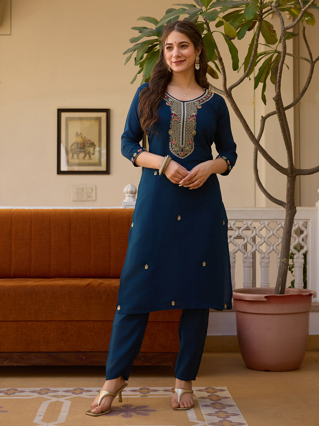 Full length front view of model confidently posing in the TRENDBUY HR-21 deep blue kurti set, highlighting subtle embroidery on kurti body.