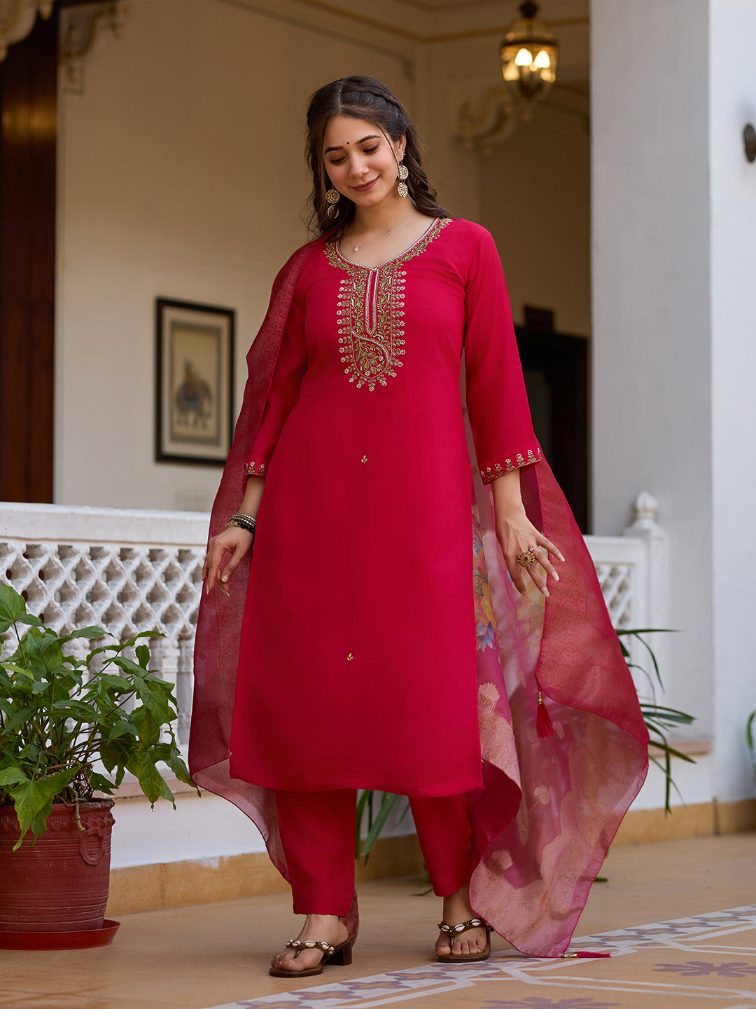 Full length view of the woman in magenta kurti set, in a relaxed pose, highlighting the outfit's comfortable fit.