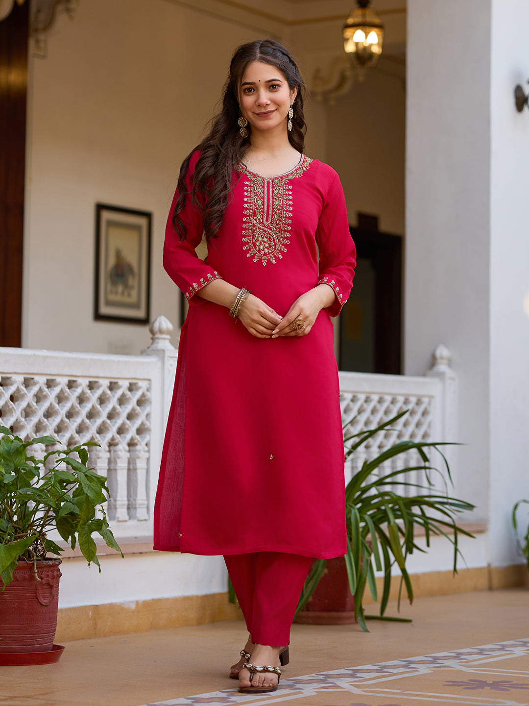 Front view of the woman in the magenta kurti set, standing casually, displaying the complete stylish ensemble.