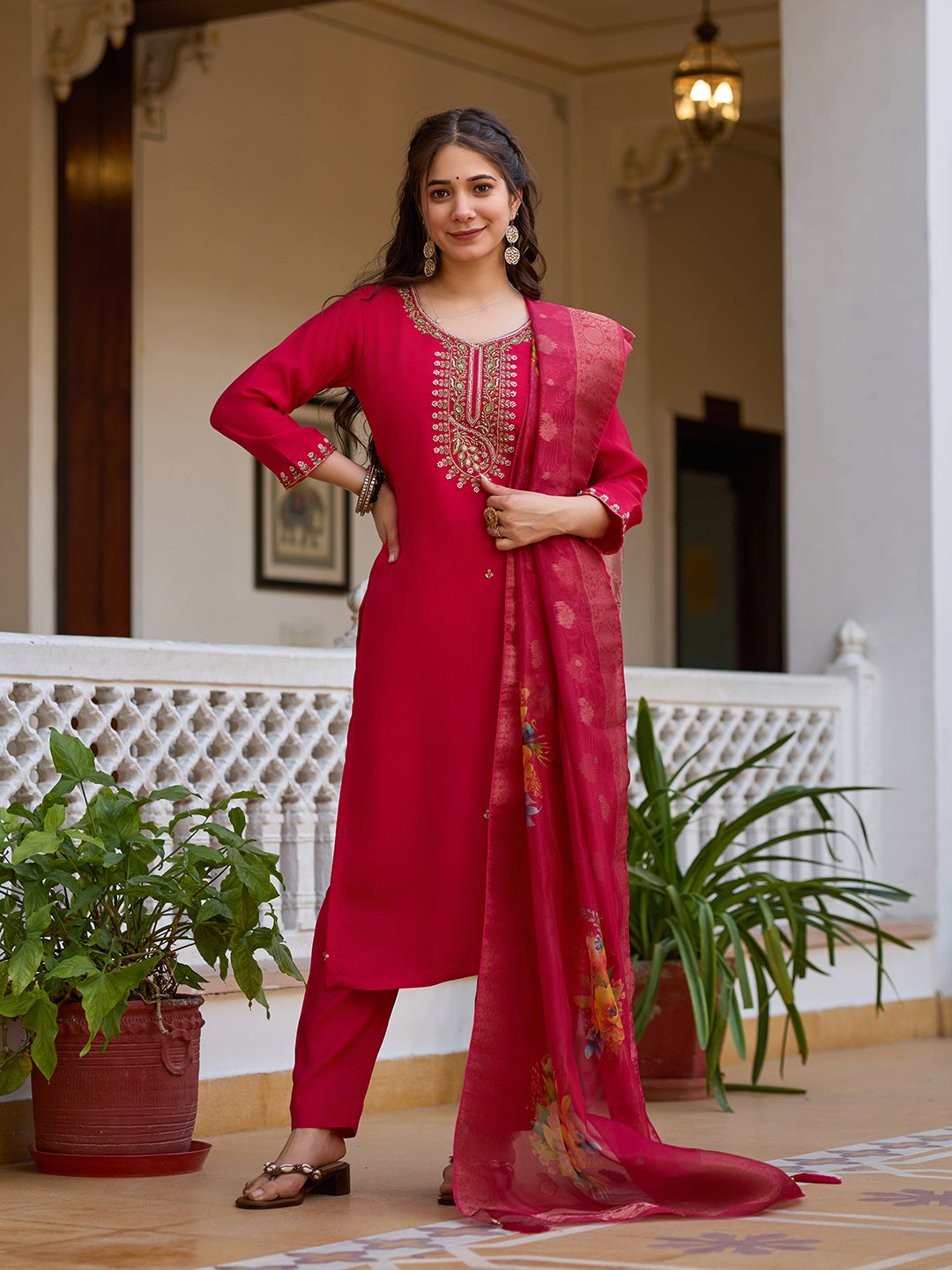 Woman posing dynamically in the TRENDBUY magenta kurti set, emphasizing the vibrant color and dupatta's intricate pattern.