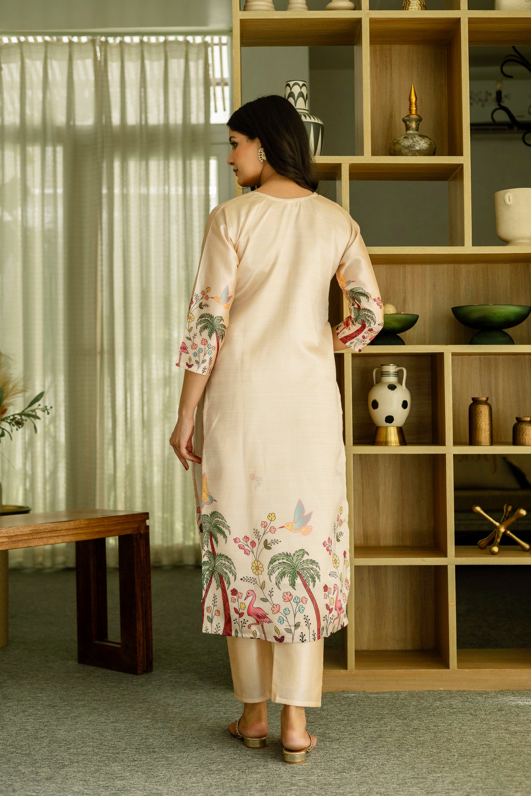 Back view of the TRENDBUY model in HR-25 Kurta Set, showcasing the continuation of the tropical embroidery design on the lower back and sleeves.