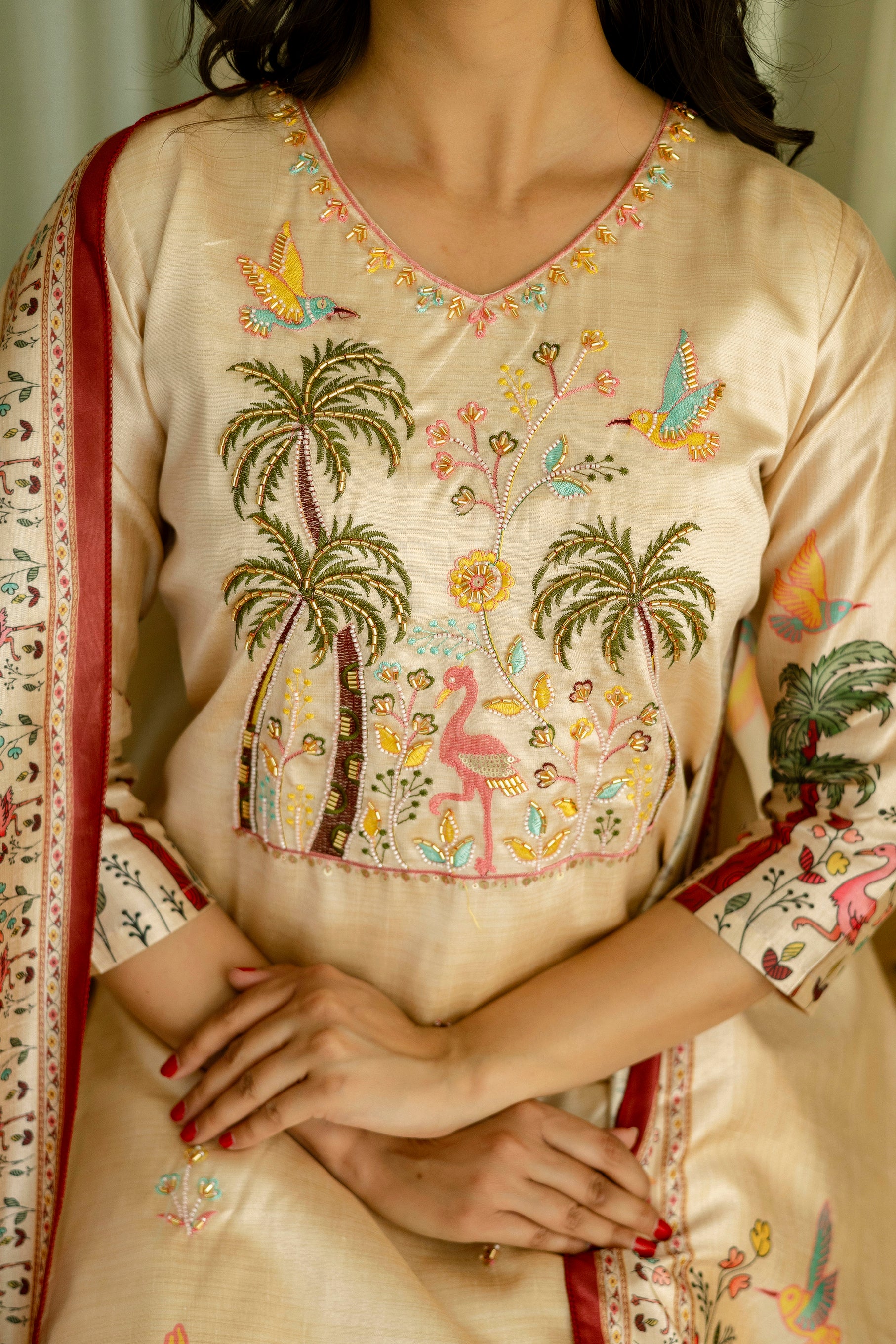Front close-up of the TRENDBUY HR-25 Kurta set, focusing on the vibrant tropical embroidery and bead detailing on the chest.