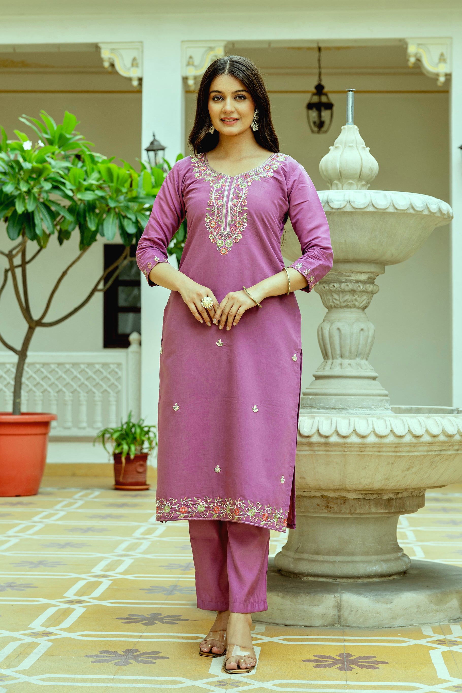 Full-length front shot of a smiling woman in the complete TRENDBUY violet chanderi silk kurti, pant, and embroidered organza dupatta set, radiating confidence