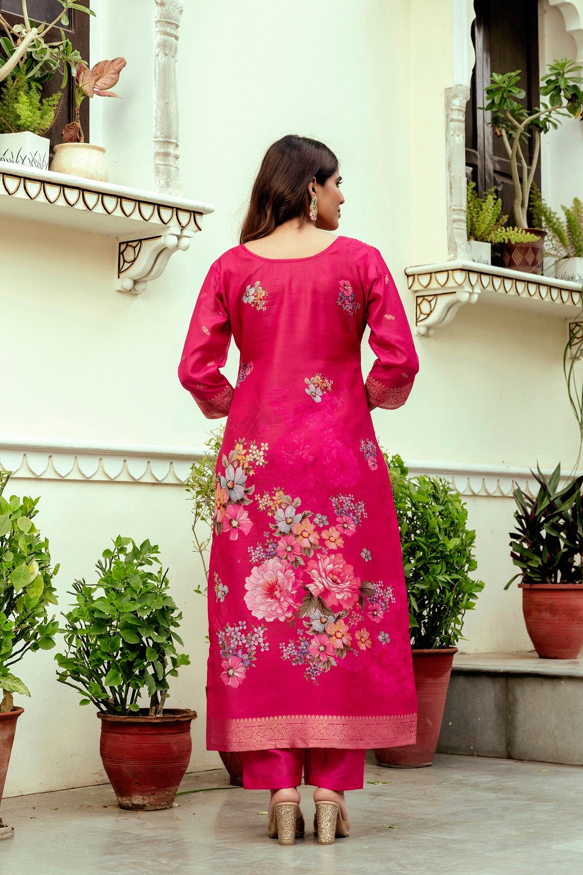 Back view of model in pink floral printed Chanderi cotton kurti set, showing pant.