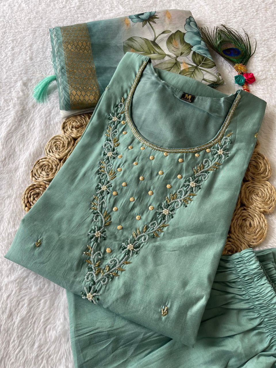 Light blue handwork cotton silk kurta set with white pants and jacquard dupatta on a model.
