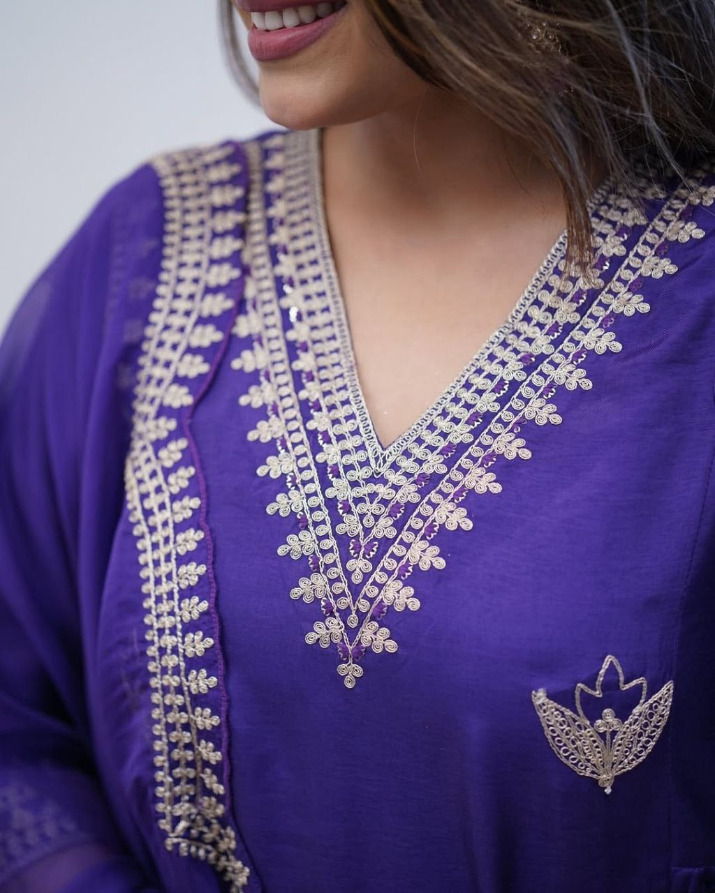 Close-up of intricate sequence coding embroidery work on the neckline of the viscose chanderi kurti