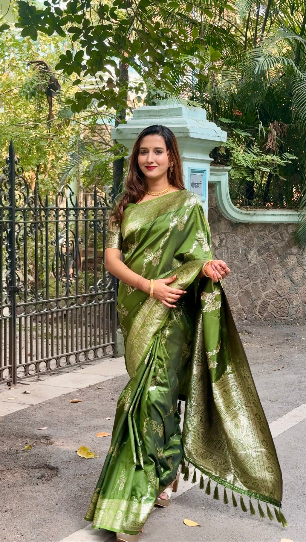 Mehndi green pure Banarasi soft silk saree with intricate gold zari border