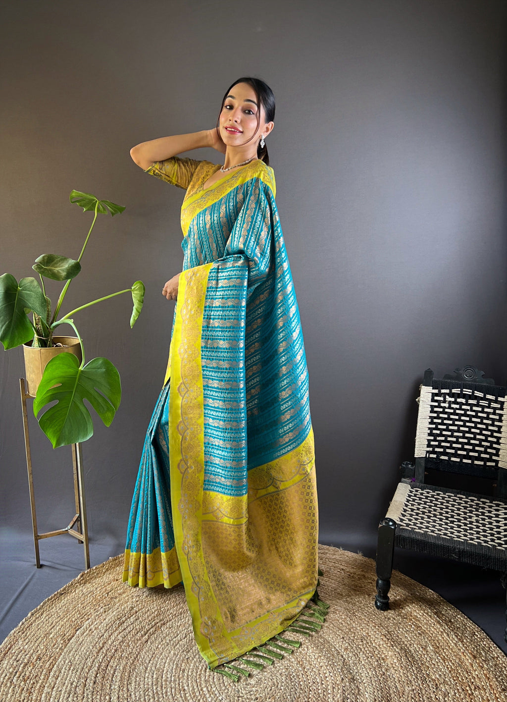 Close-up of intricate gold zari floral patterns woven into sky blue silk fabric