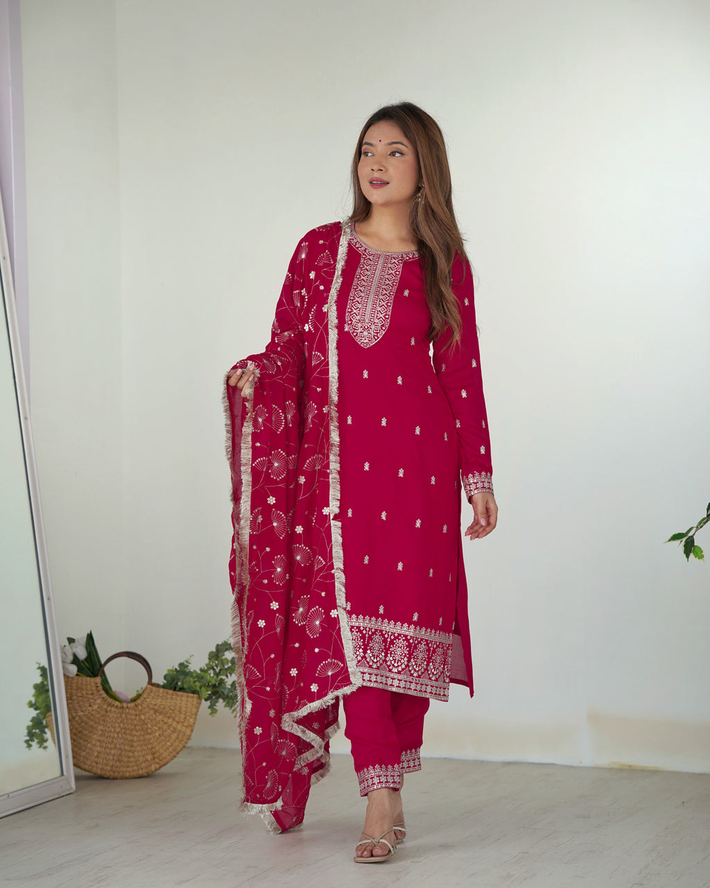Rani Pink Embroidered Blooming Rangoli Silk Kurta Set worn by a model, showcasing intricate floral patterns.