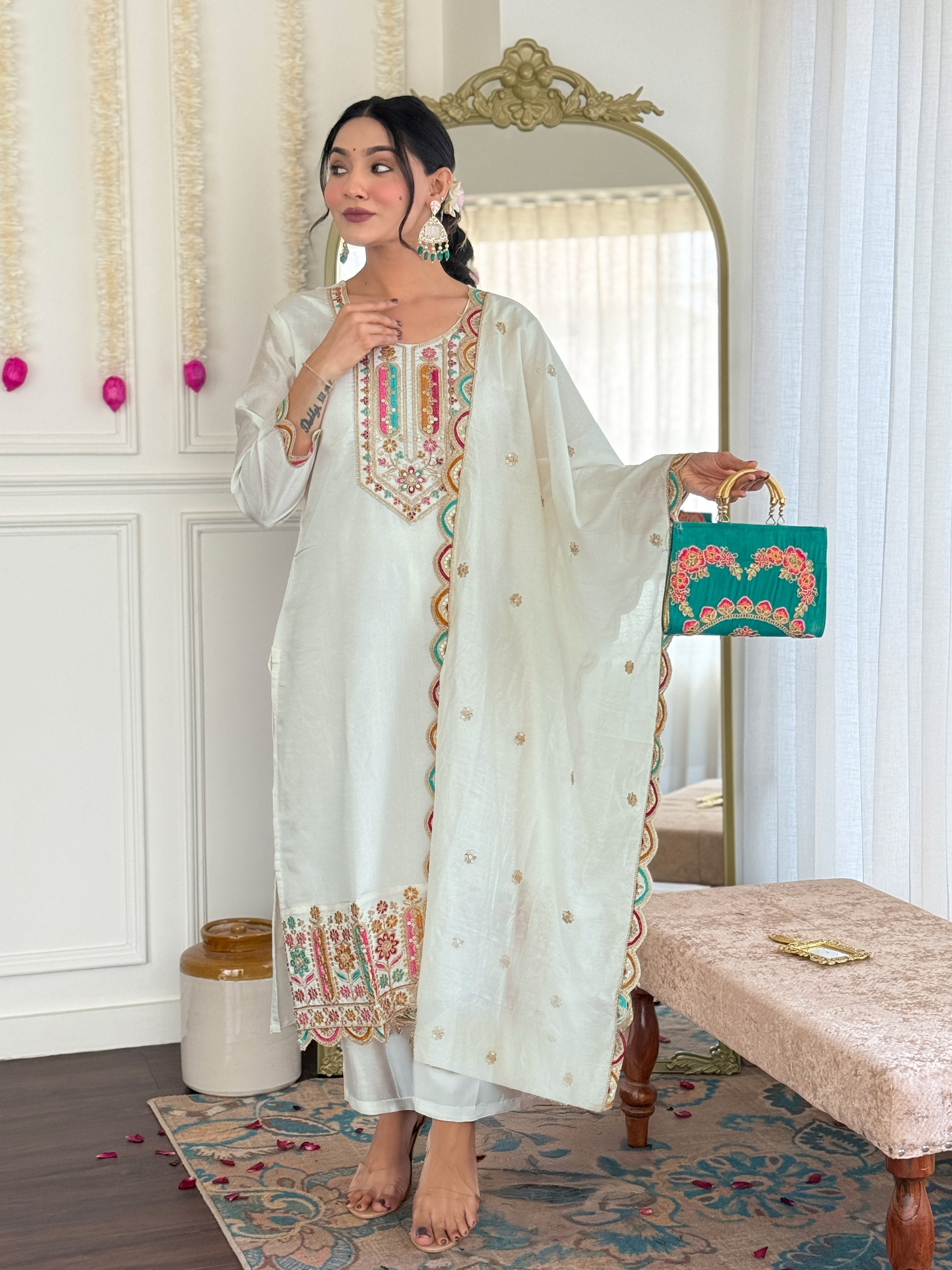 Model posing gracefully in TRENDBUY's white Viscose Chanderi kurta set, highlighting the intricate embroidery and flowing dupatta.