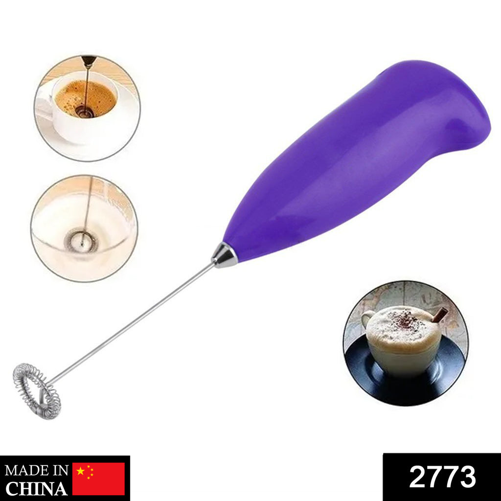 2773 hand blender actively mixing food in a bowl for home blending tasks.