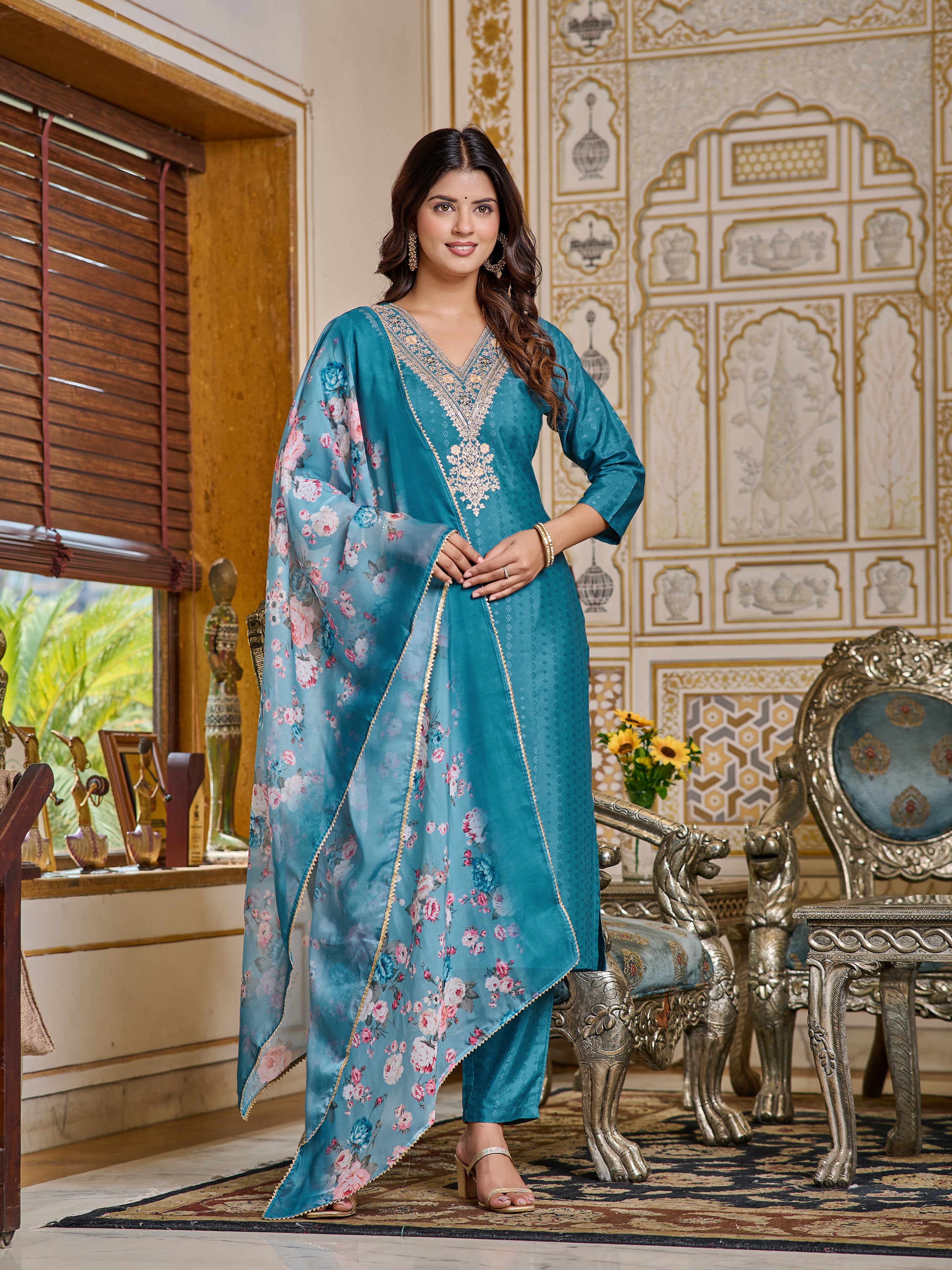 Full view of model gracefully posing in a teal blue embroidered viscose rayon kurta set with floral digital print dupatta by TRENDBUY.