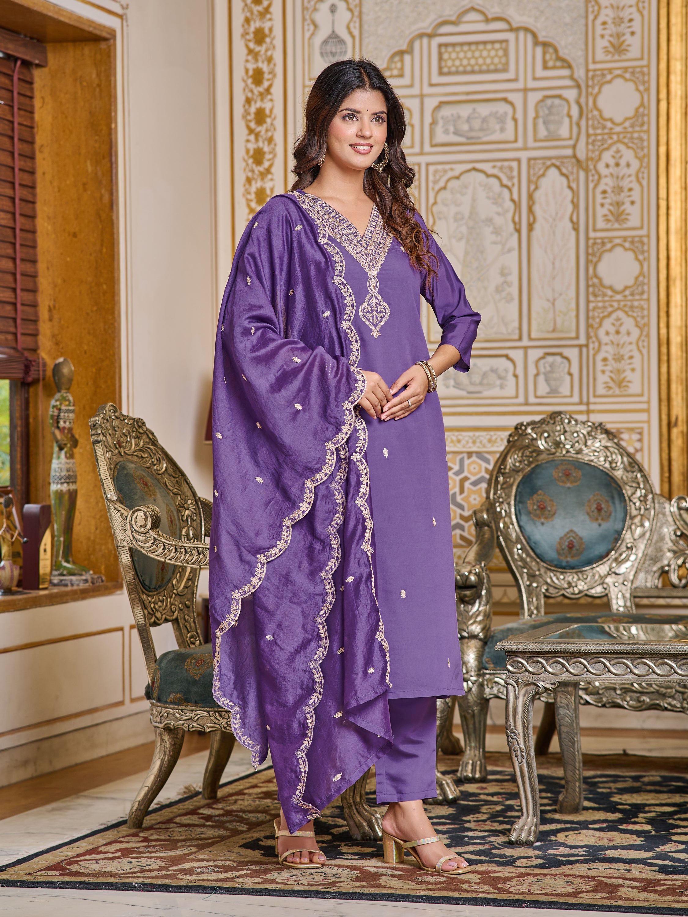 Woman posing gracefully in purple chanderi kurti set, showcasing the flow of the dupatta.