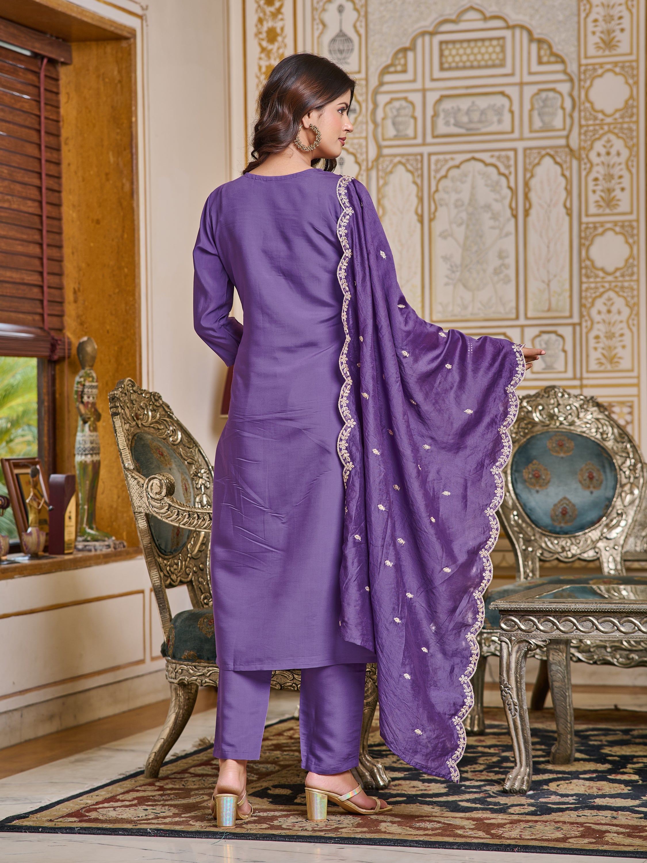 Back view of woman in purple chanderi kurti set, highlighting simple back and dupatta drape.